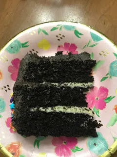 White chocolate ganache between thick layers of dark chocolate cake