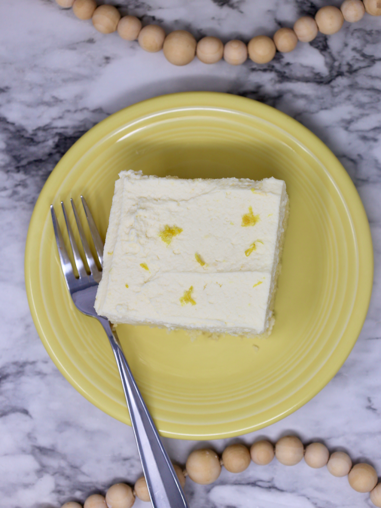 Lemon Poke Cake with mascarpone cheese topping