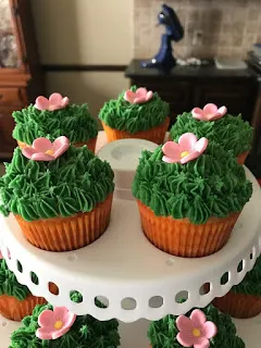 Display of Cactus Cupcakes with Flower