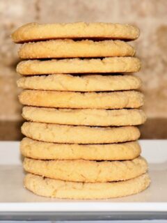 stacked peanut butter cookies showing off their straight sides and even baking