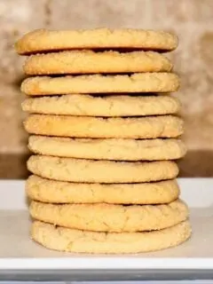 stacked peanut butter cookies showing off their straight sides and even baking