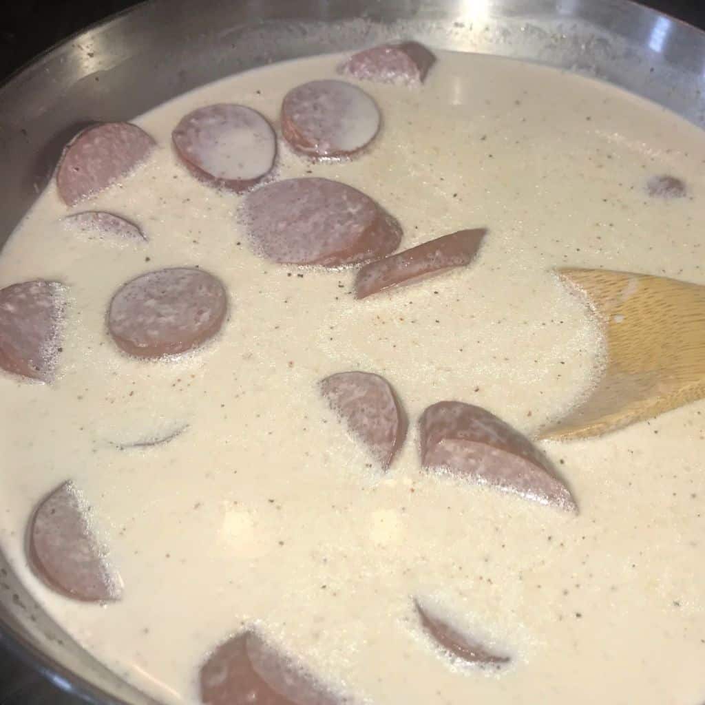 Sausages Cooking in Cream Sauce