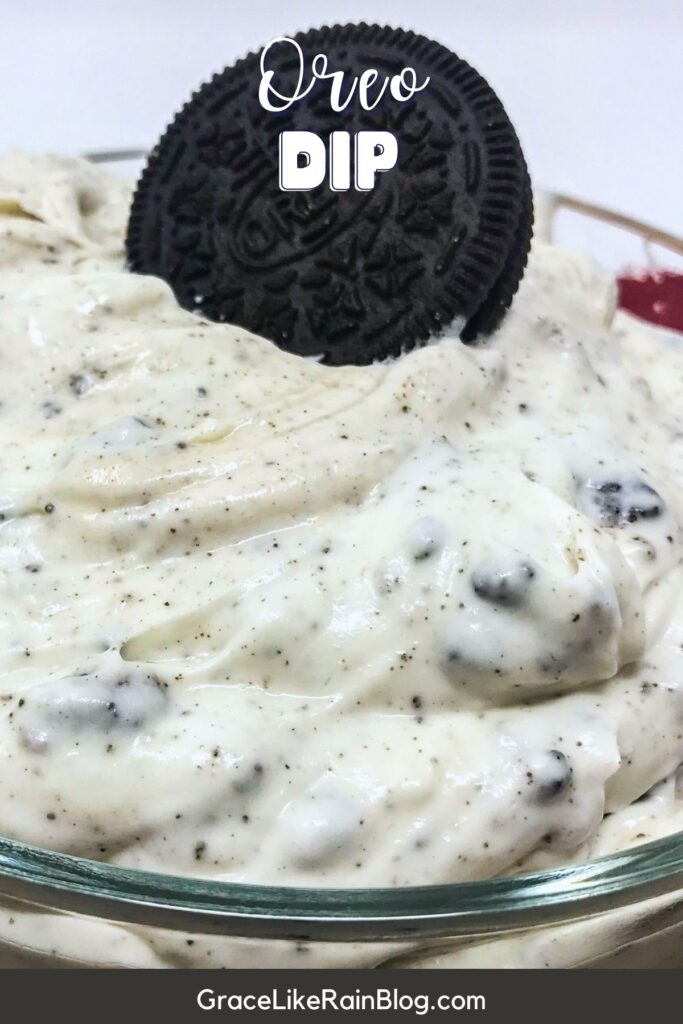 oreo dip in a serving dish with an oreo on top