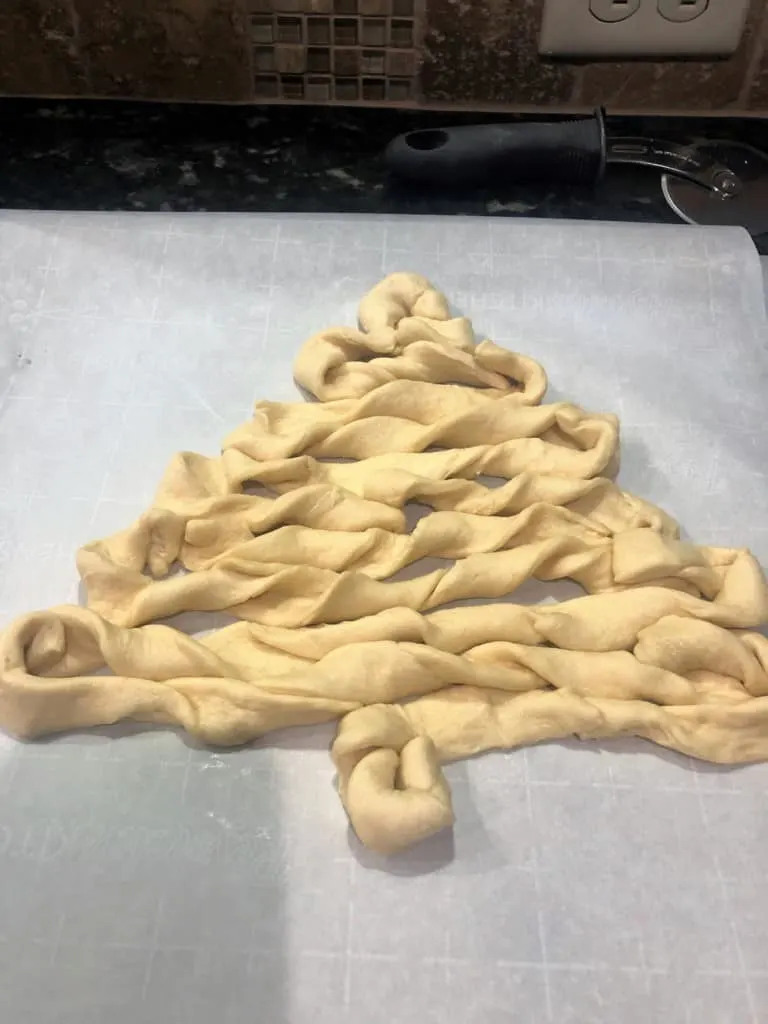 Crescent Roll Dough Shaped Into Christmas Tree