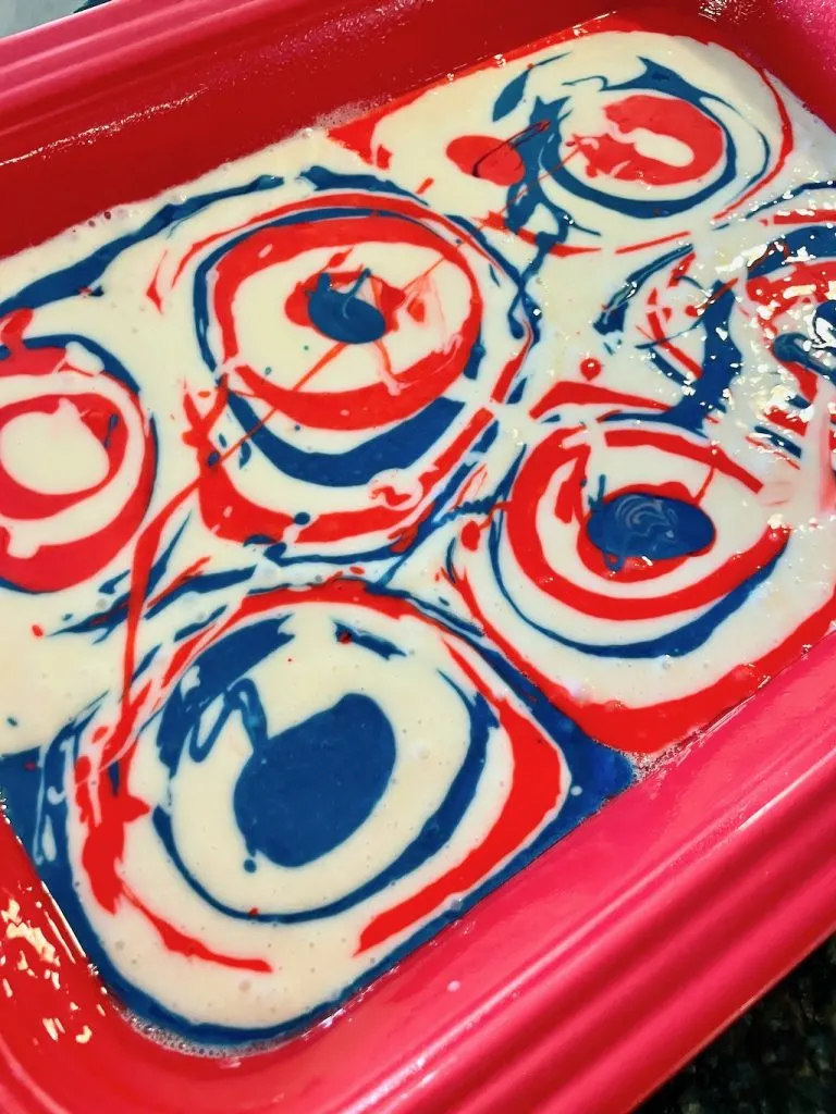 colorful batter for red white and blue poke cake
