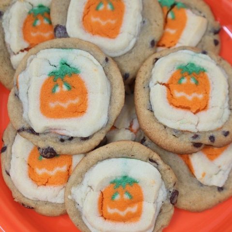 Halloween Double Decker Cookies on an orange plate, sugar cookies on top of chocolate chip cookies