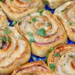ham and cheese crescent pinwheels in a blue baking dish