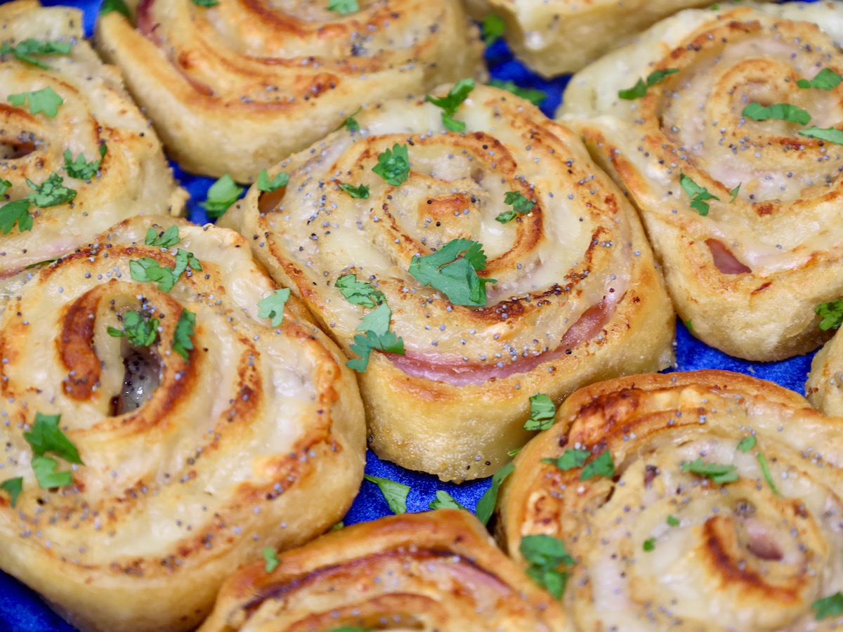 ham and cheese crescent pinwheels in a blue baking dish