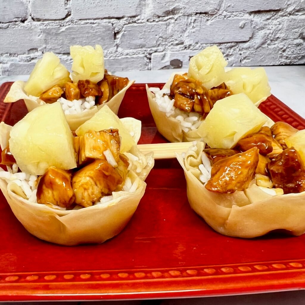 teriyaki chicken, white rice, and pineapple filling a wonton is a perfect appetizer