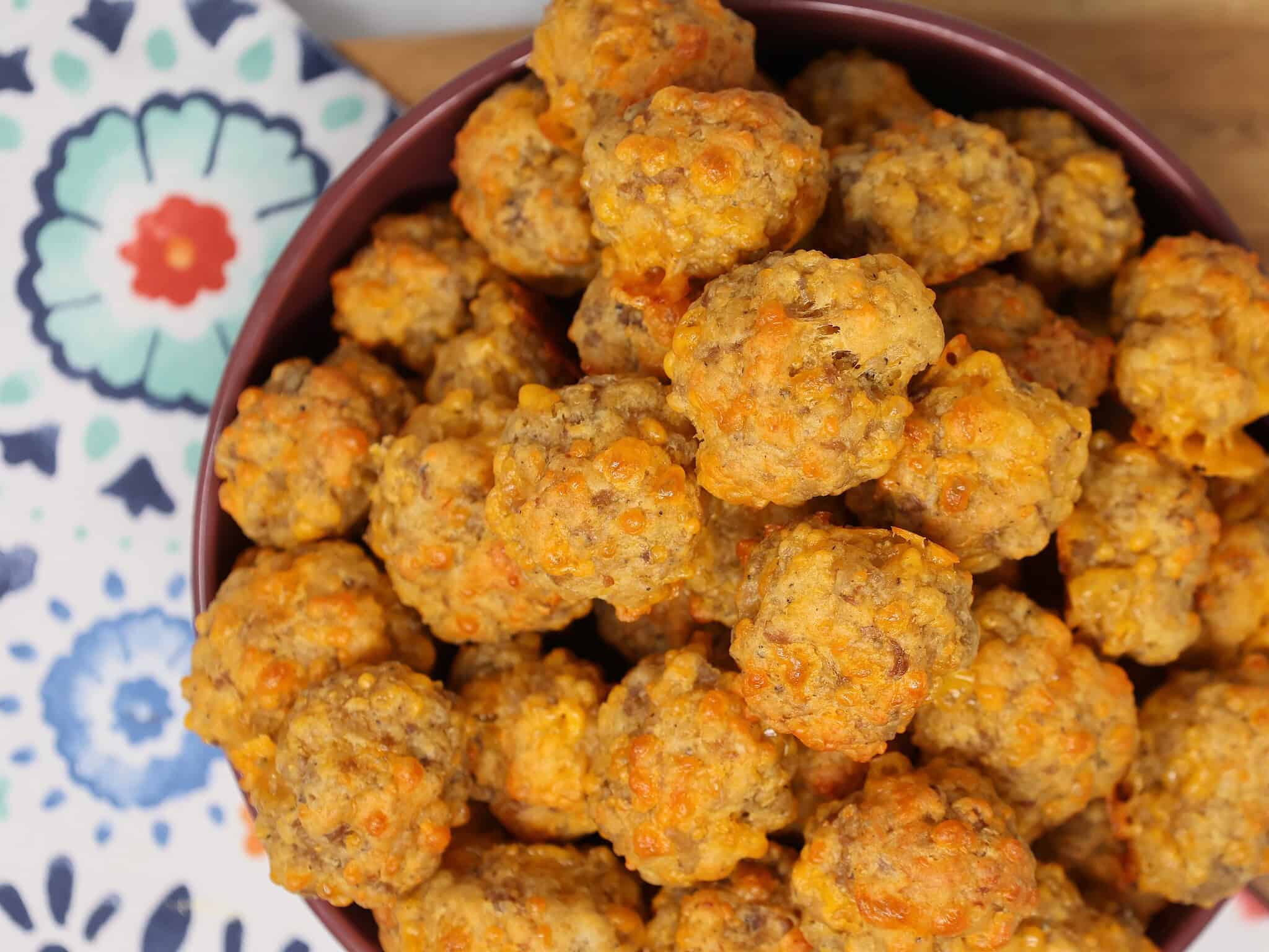 a bowl full of sausage balls at a party