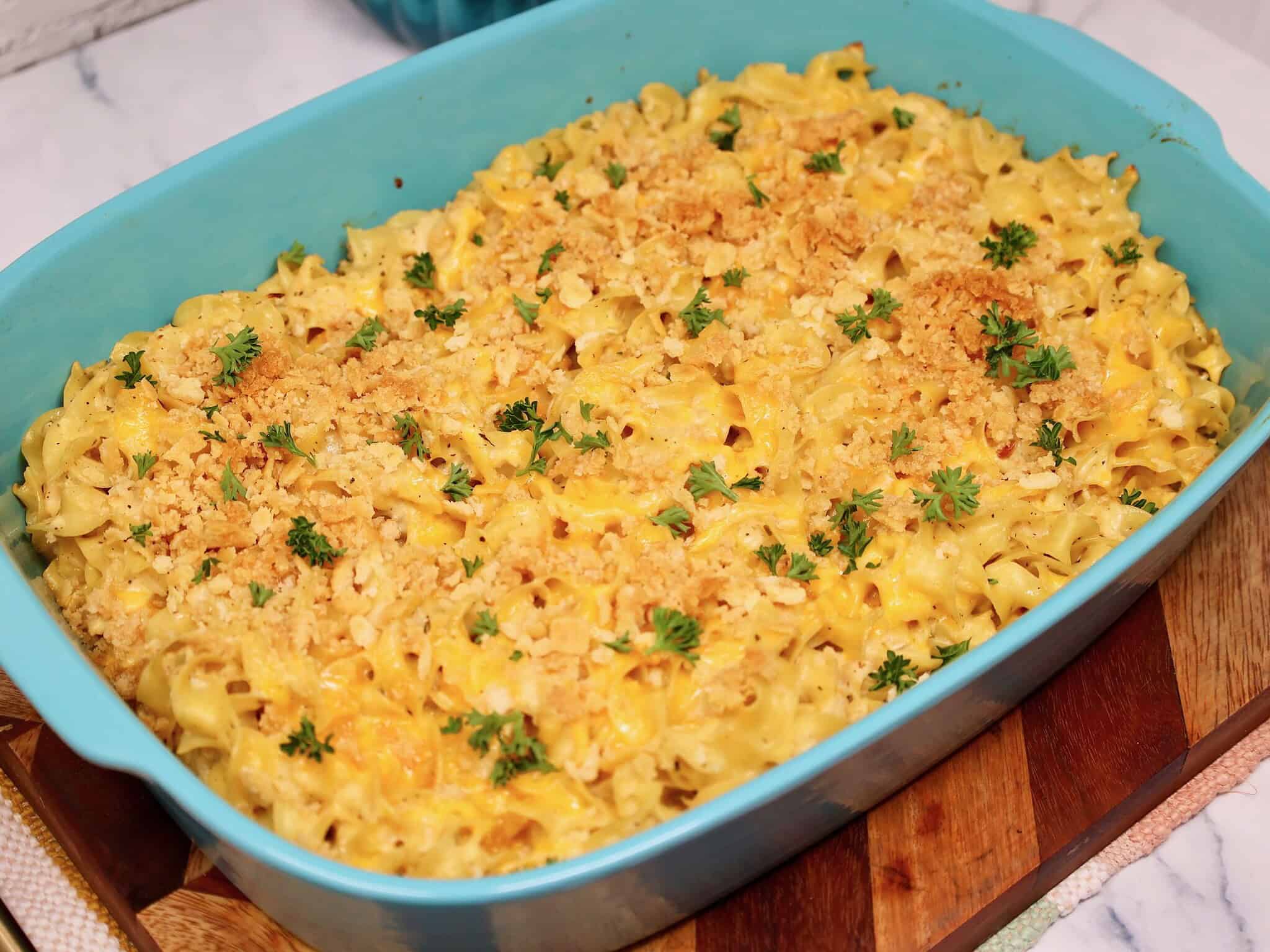 creamy canned chicken and noodle casserole in a 9x13-inch casserole dish topped with crushed ritz crackers