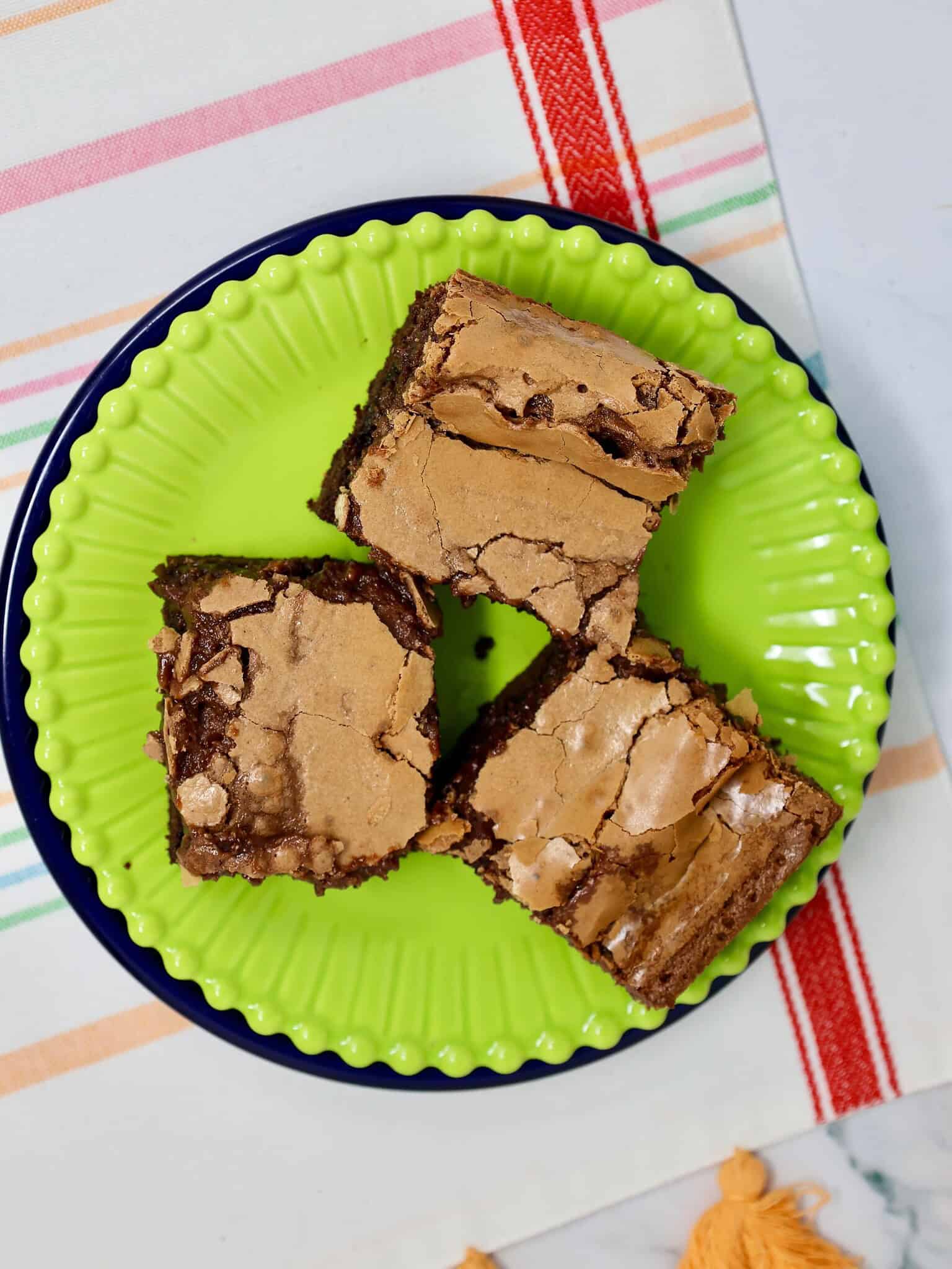 three slices of chocolate gooey butter cake made with chocolate cake mix