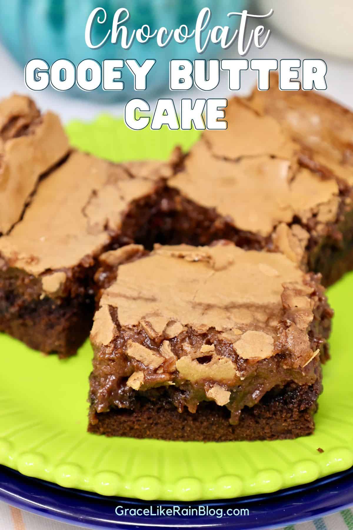 Chocolate Gooey Butter Cake bars with a crackly top on a plate for serving