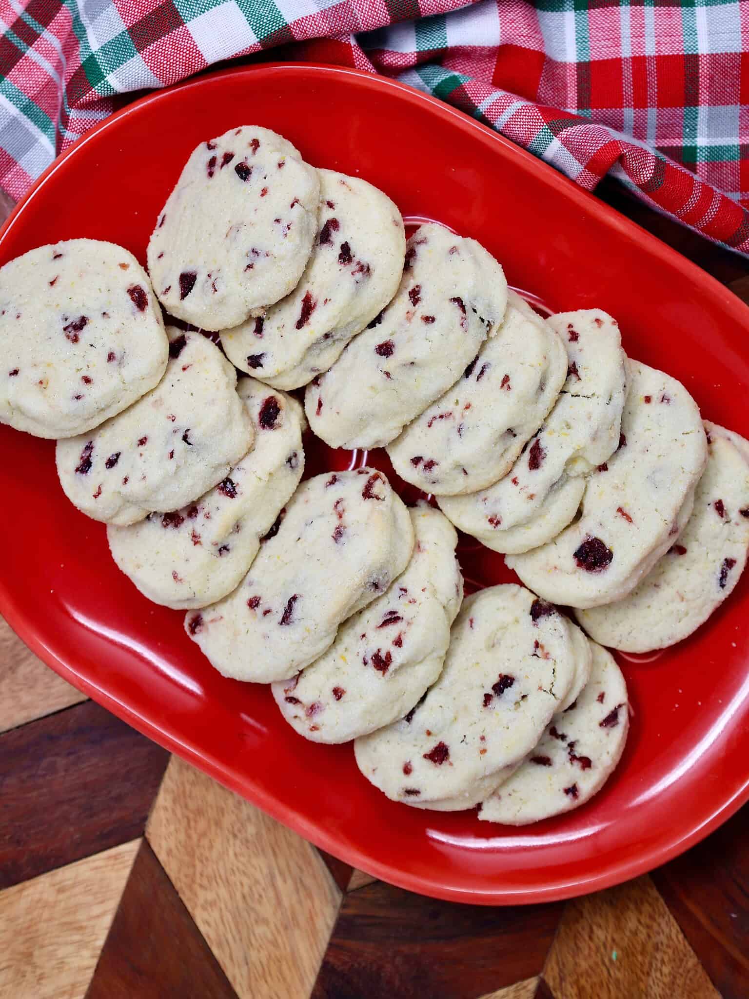orange cranberry shortbread cookies on a christmas tray
