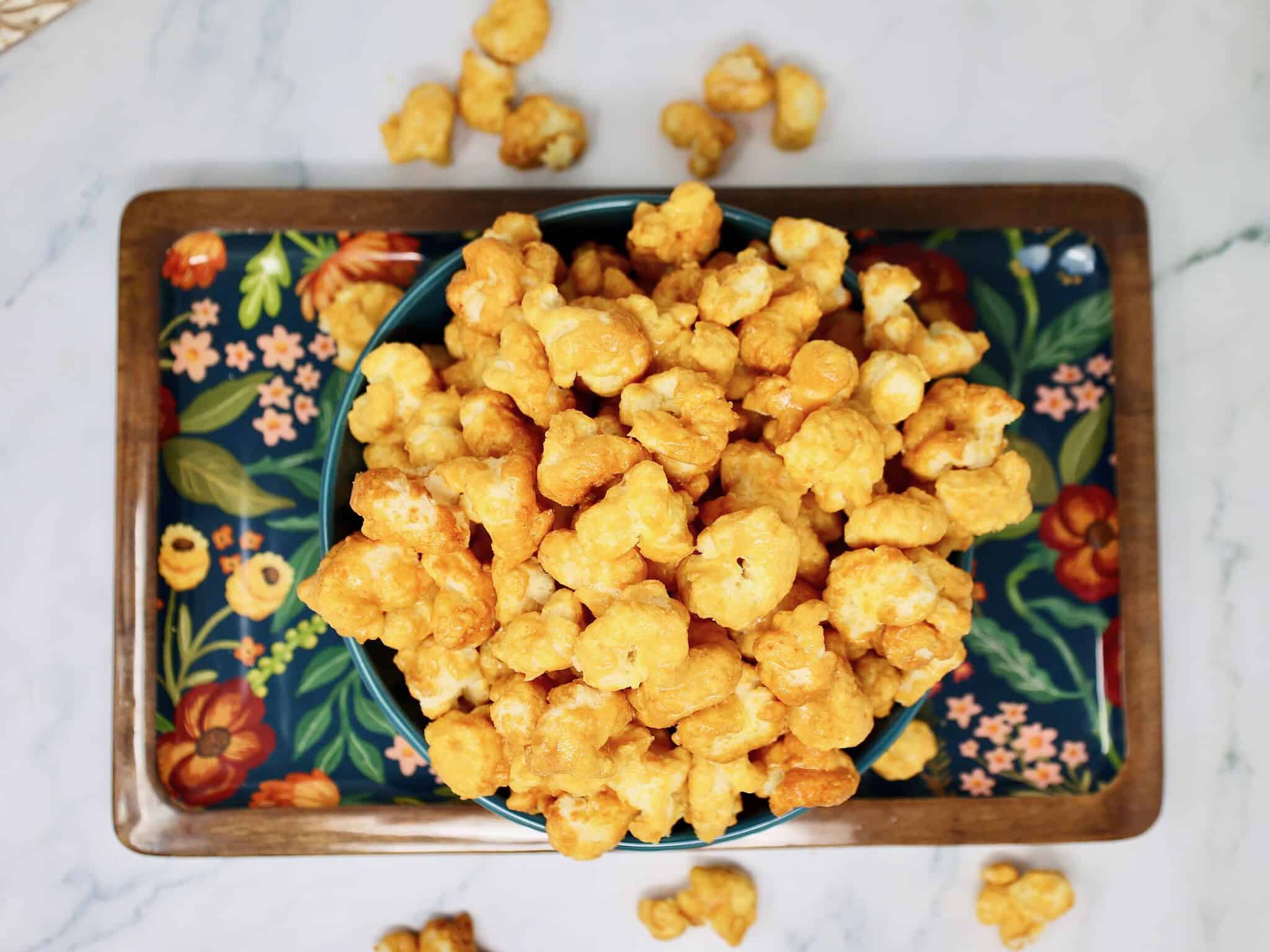 brown sugar caramel sauce cooking in saucepan for Beaver Nuggets copycat recipe