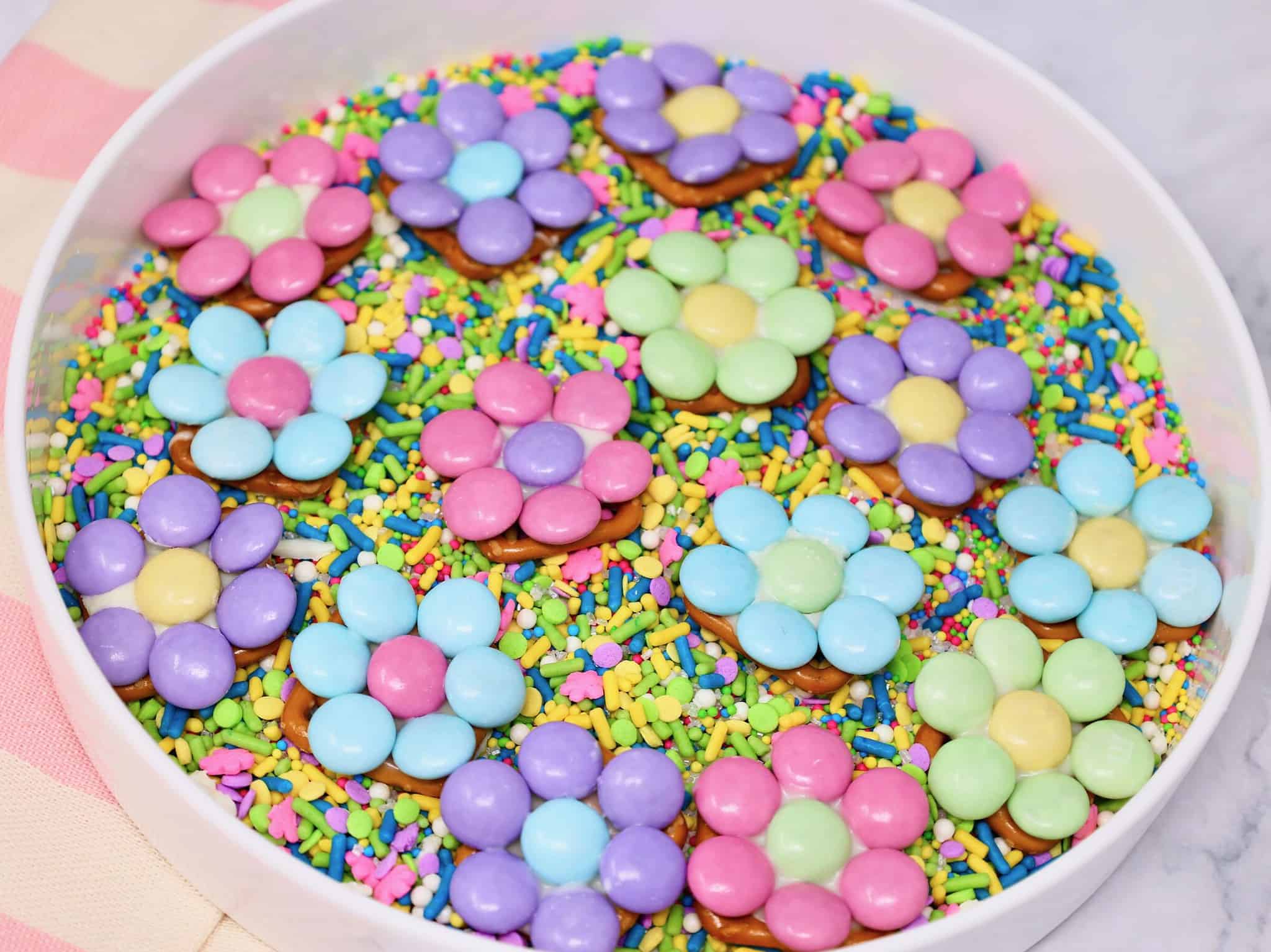 step by step making Easter pretzel flowers with M&Ms