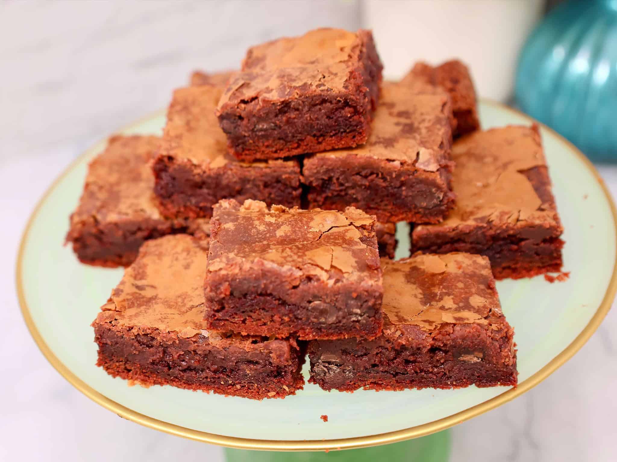 slice of red velvet gooey butter cake showing the creamy chocolate cream cheese filling