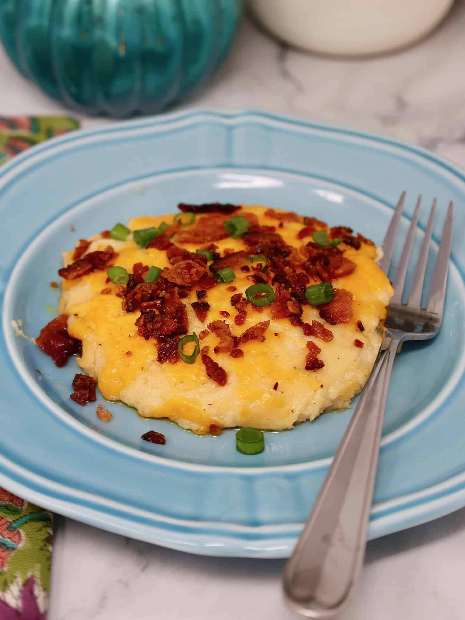 baked cheesy mashed potato casserole with golden melted cheese on top