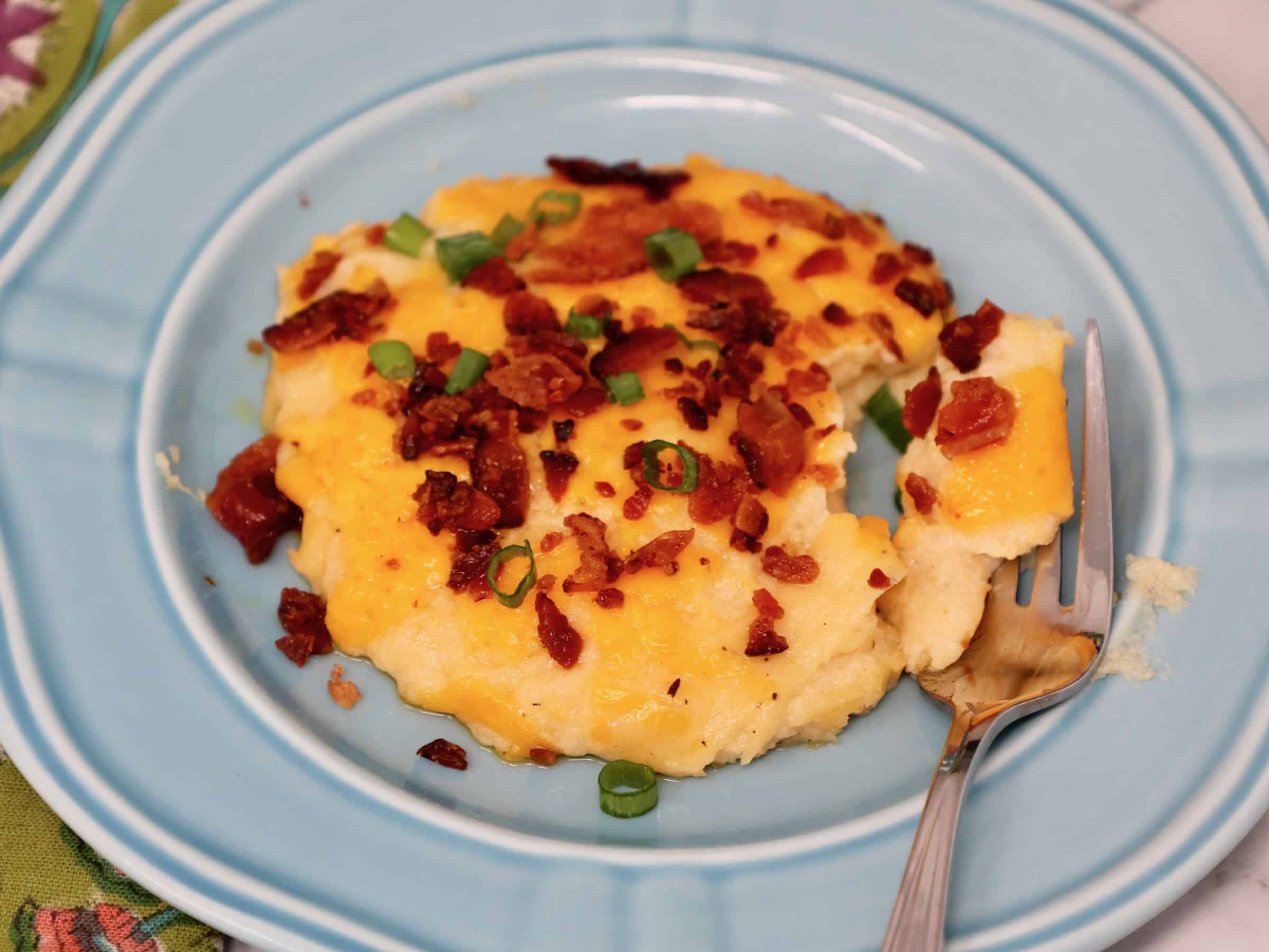 homemade cheesy mashed potato casserole in 9x9 baking dish