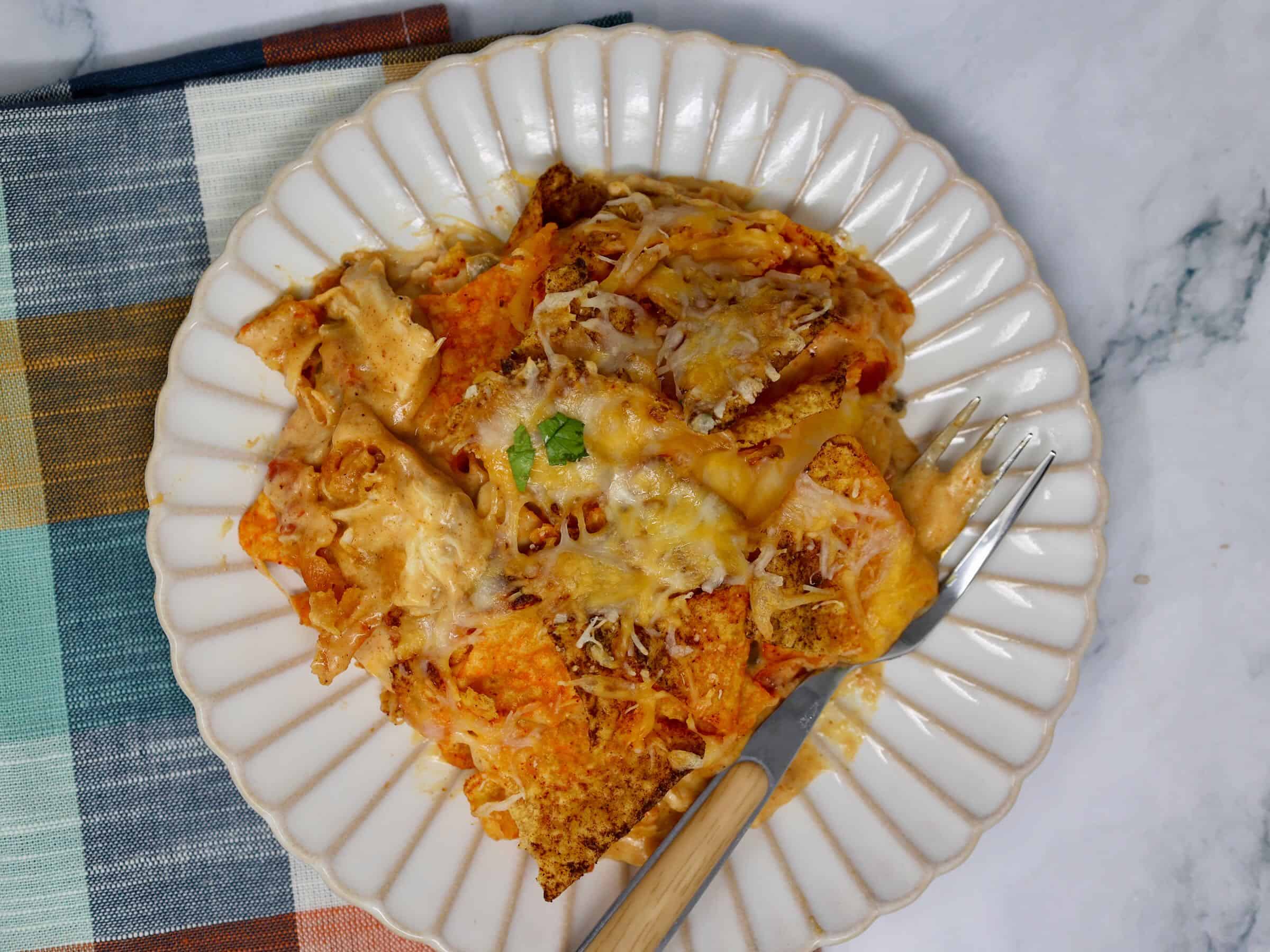 close up of Doritos chicken casserole showing creamy texture and corn