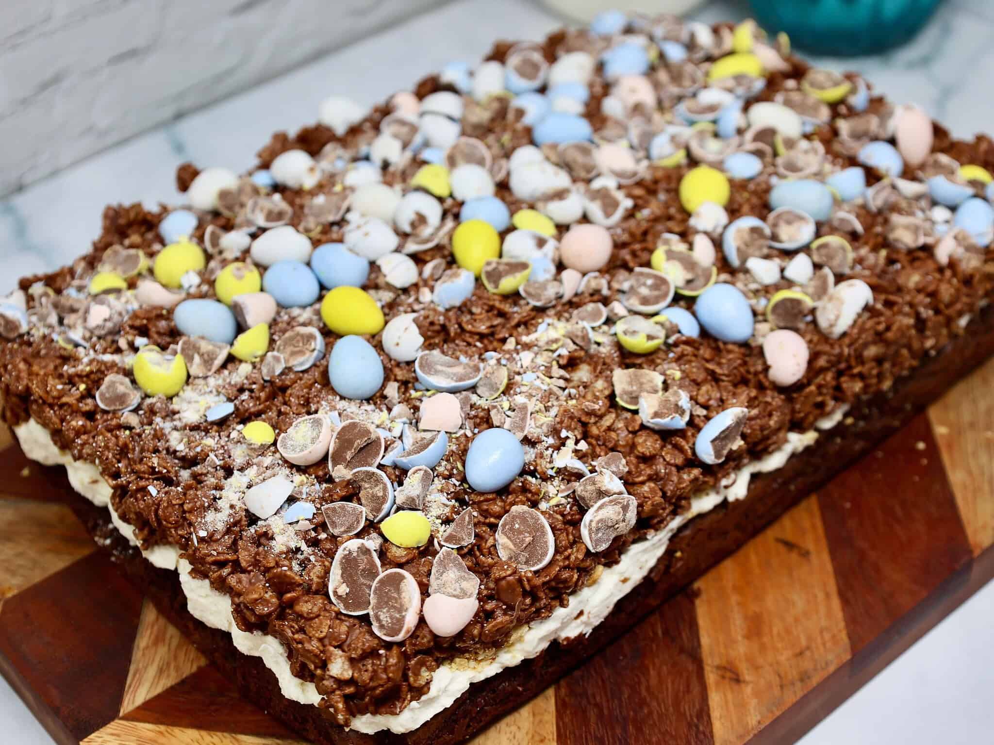a 9x13-inch pan of Rice Krispies Brownies with Easter candy on top ready to be sliced and served