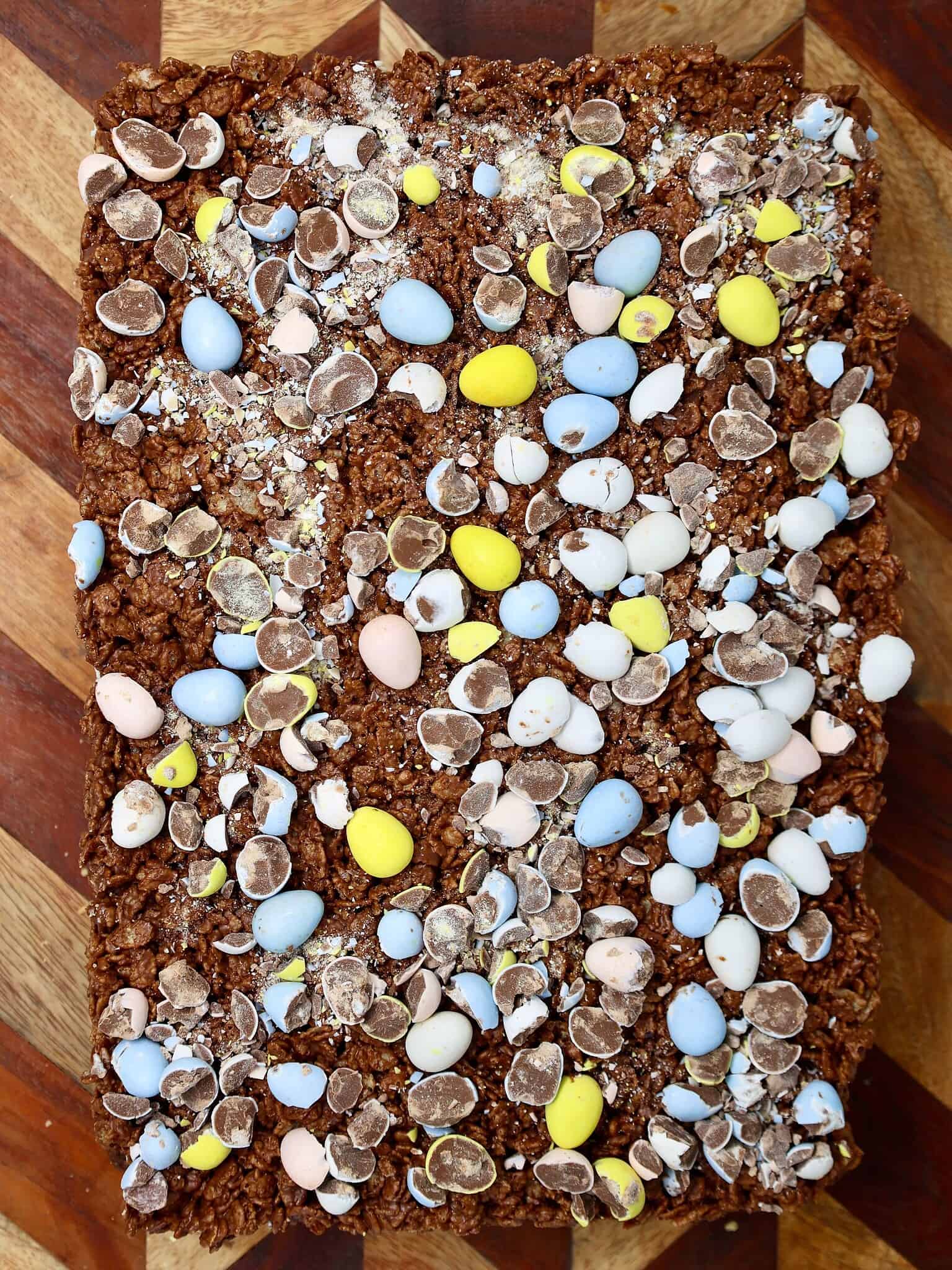layered brownies with frosting and Rice Krispies topping