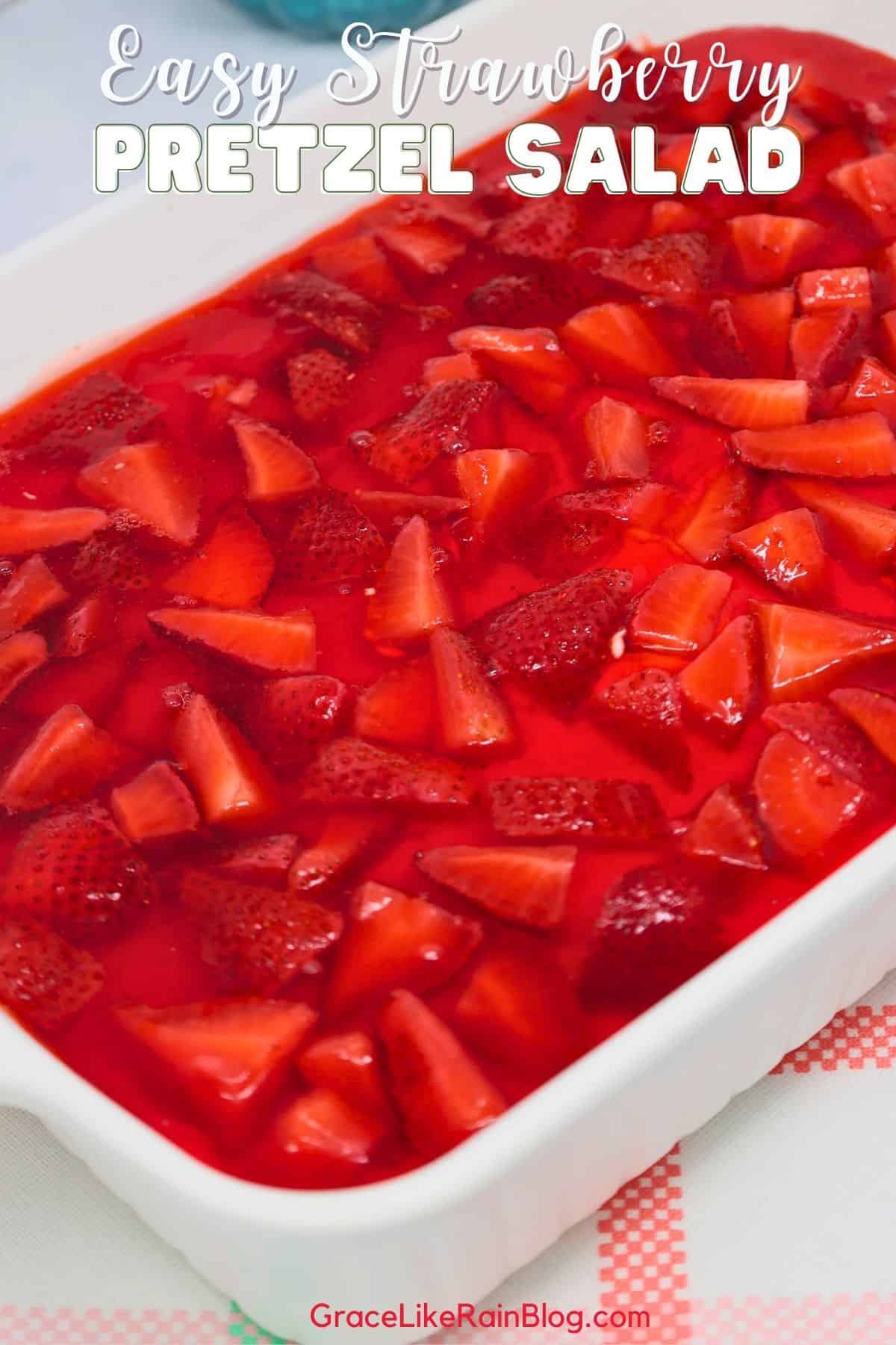 Easy strawberry pretzel salad with fresh strawberries, creamy cheesecake layer, and crunchy pretzel crust in a 9x13 inch baking dish