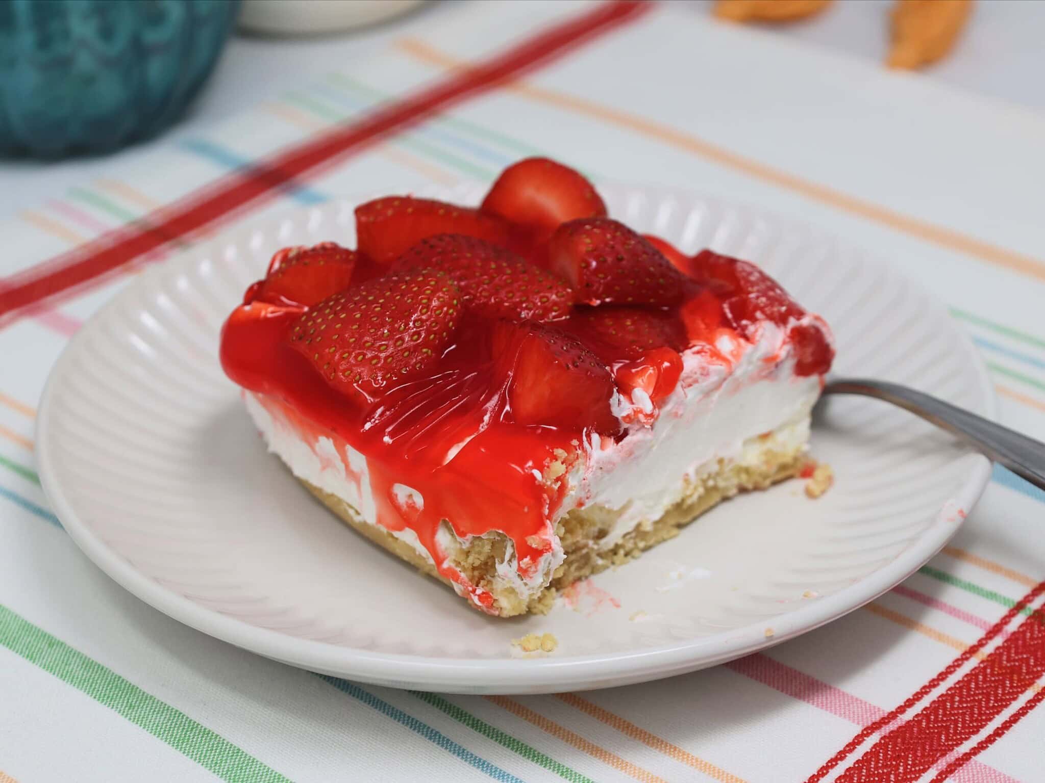 creamy strawberry cheesecake dessert square with Oreo crust