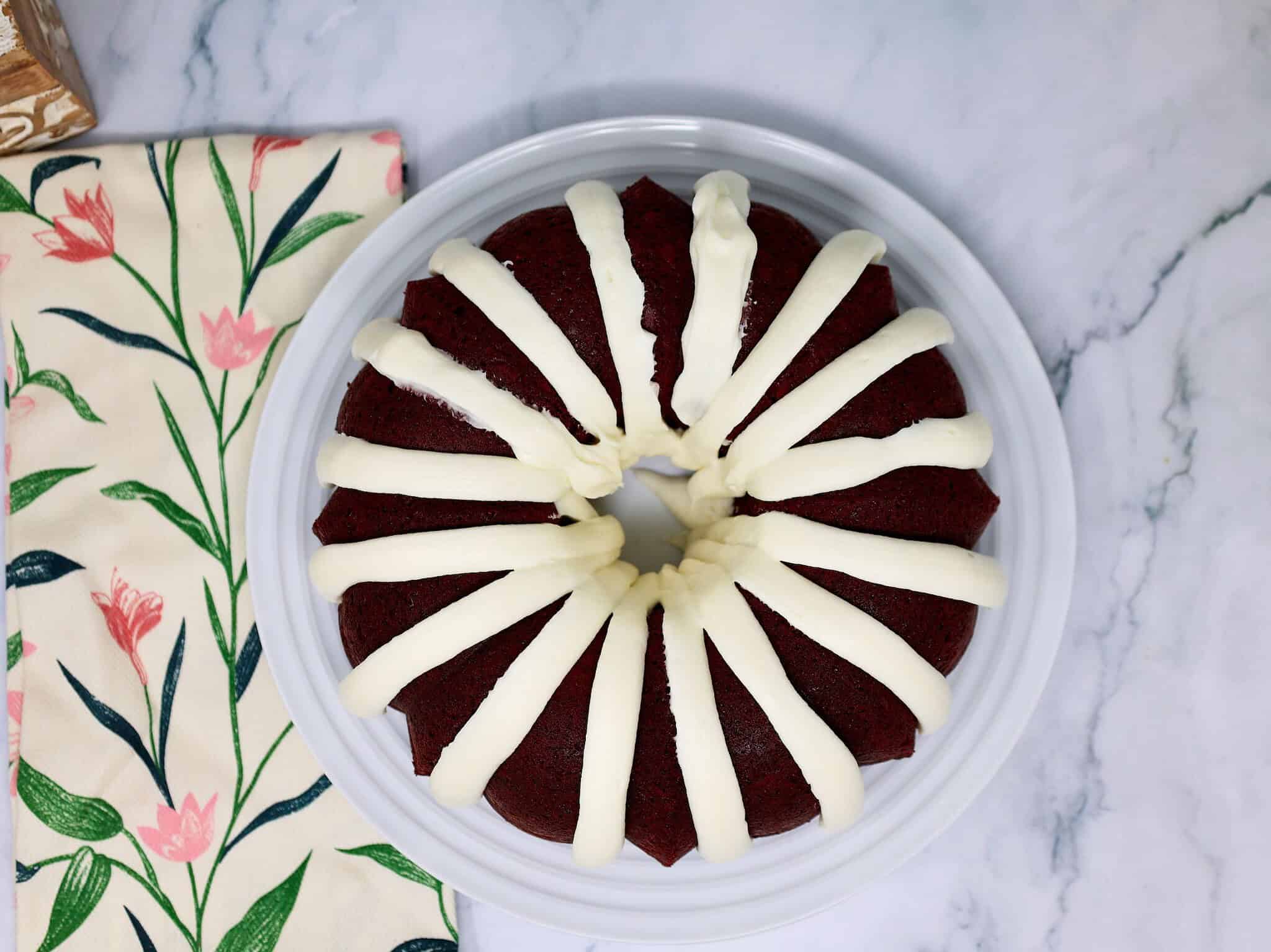 Bakery-style red velvet cake with thick cream cheese frosting