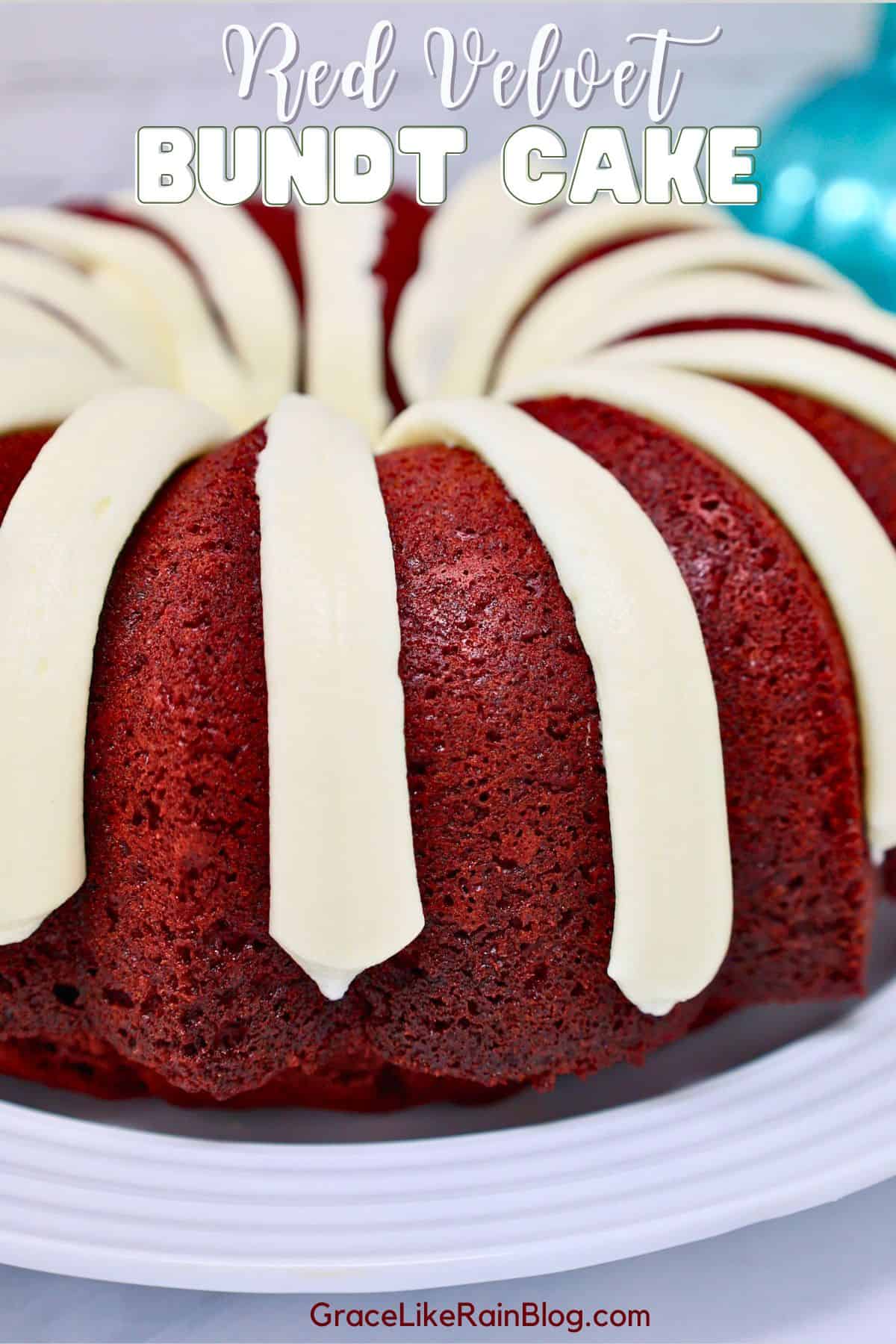 Moist red velvet Bundt cake with cream cheese frosting on a white cake stand