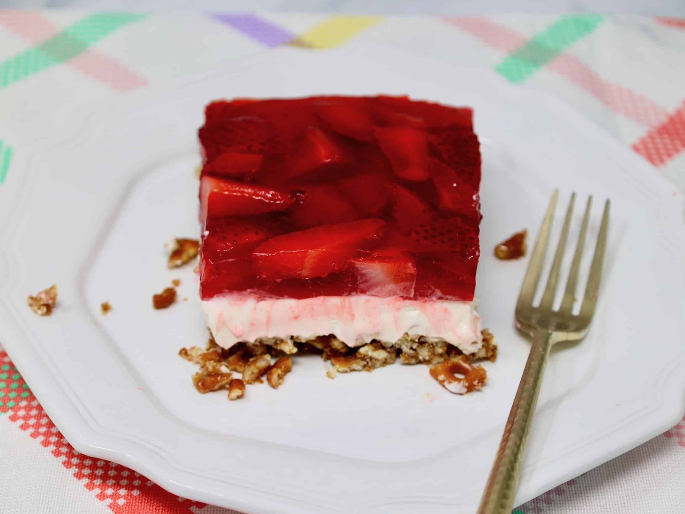 strawberry pretzel salad ready to serve at your next gathering