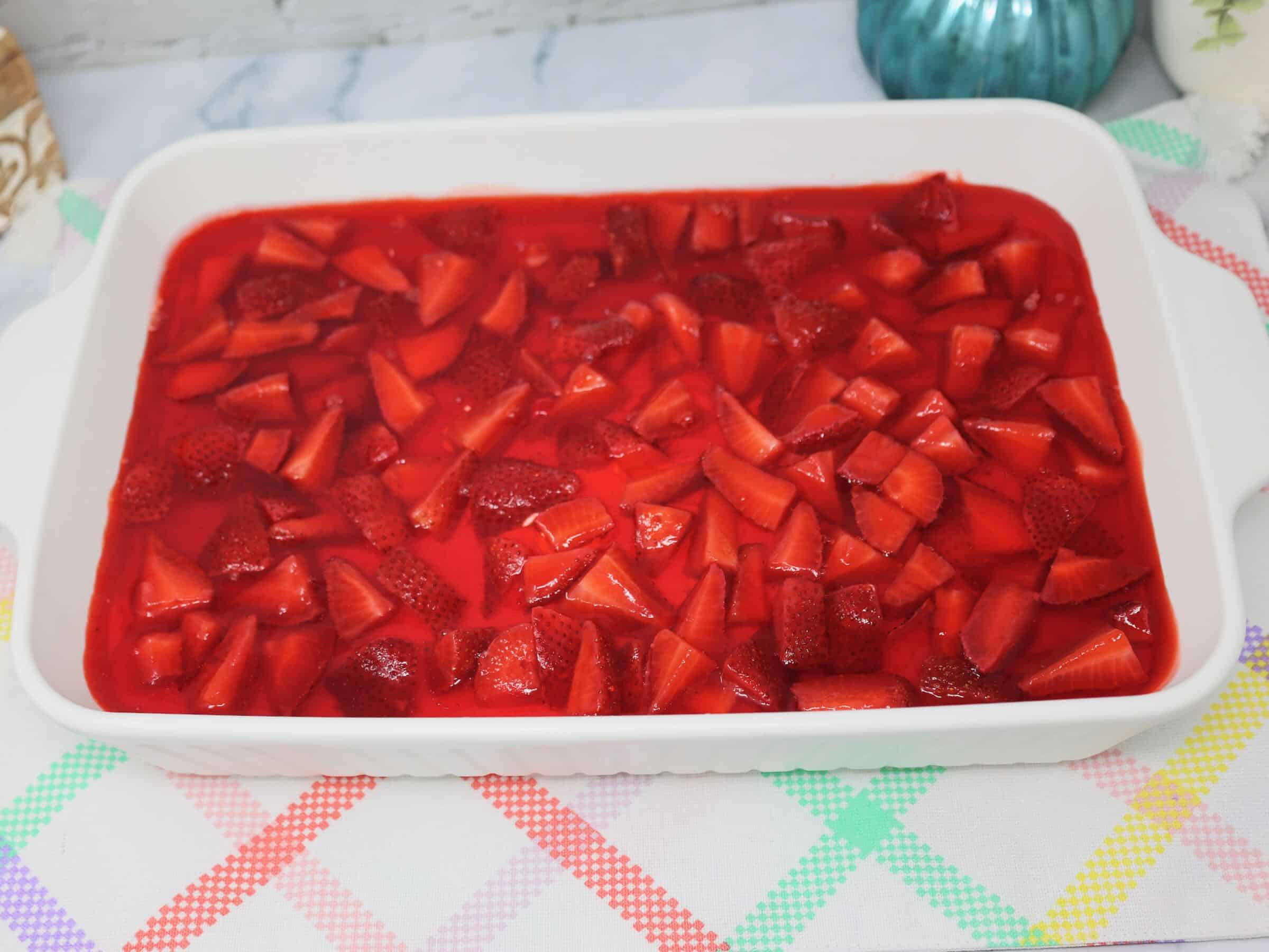 Delicious strawberry pretzel salad with fresh strawberries and a sweet, tangy topping. Perfect make-.