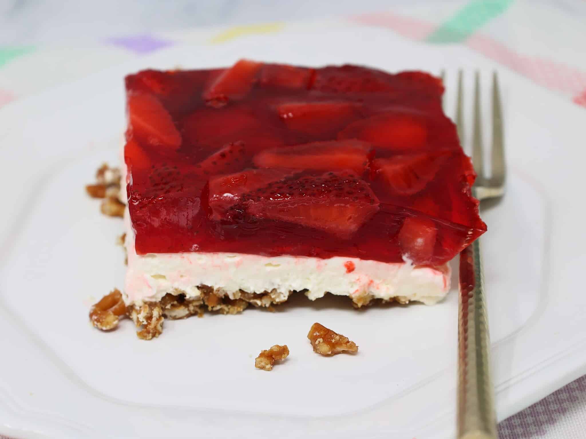Fully set strawberry pretzel salad after chilling with firm layers ready to slice and serve