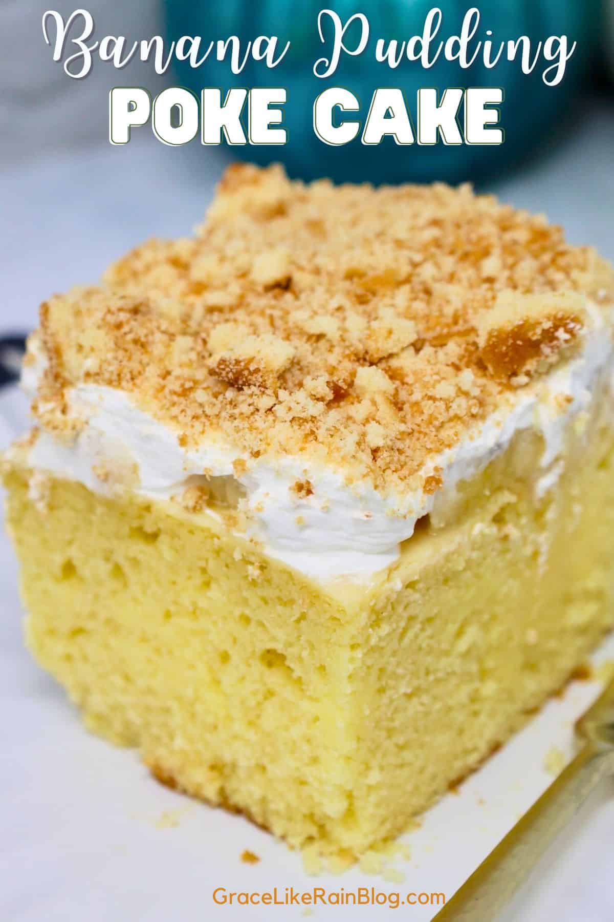 A slice of moist banana pudding cake with condensed milk showing the yellow cake layers filled with creamy banana pudding.