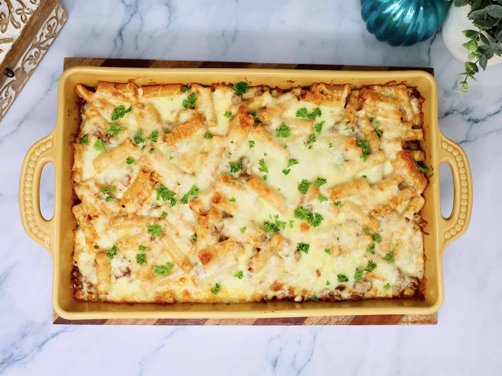 Easy baked ziti without ricotta topped with melted mozzarella cheese