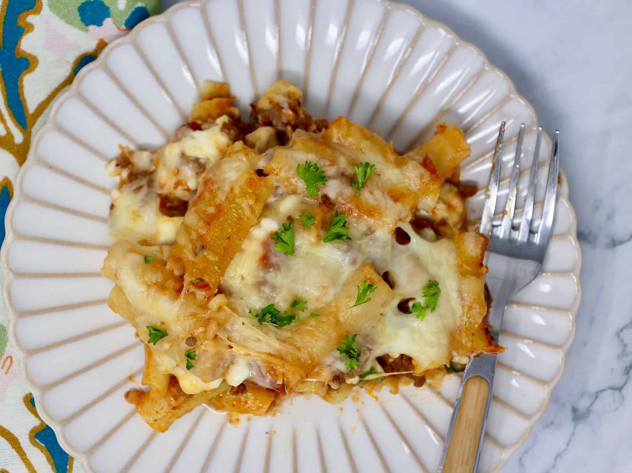High protein baked ziti recipe with layers of pasta, sauce, and cheese
