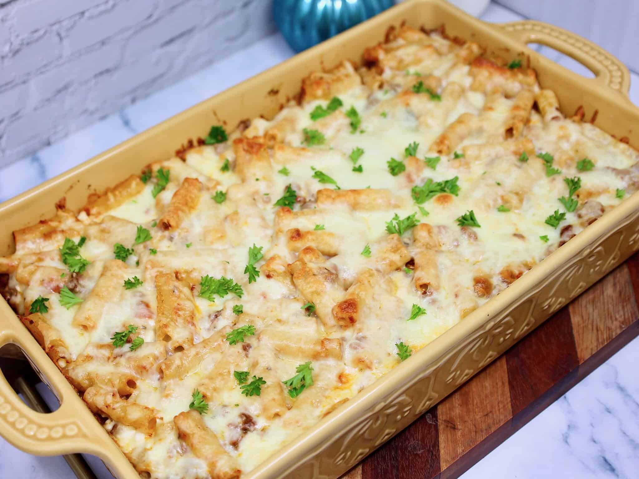 Family style high protein baked ziti casserole in a baking dish