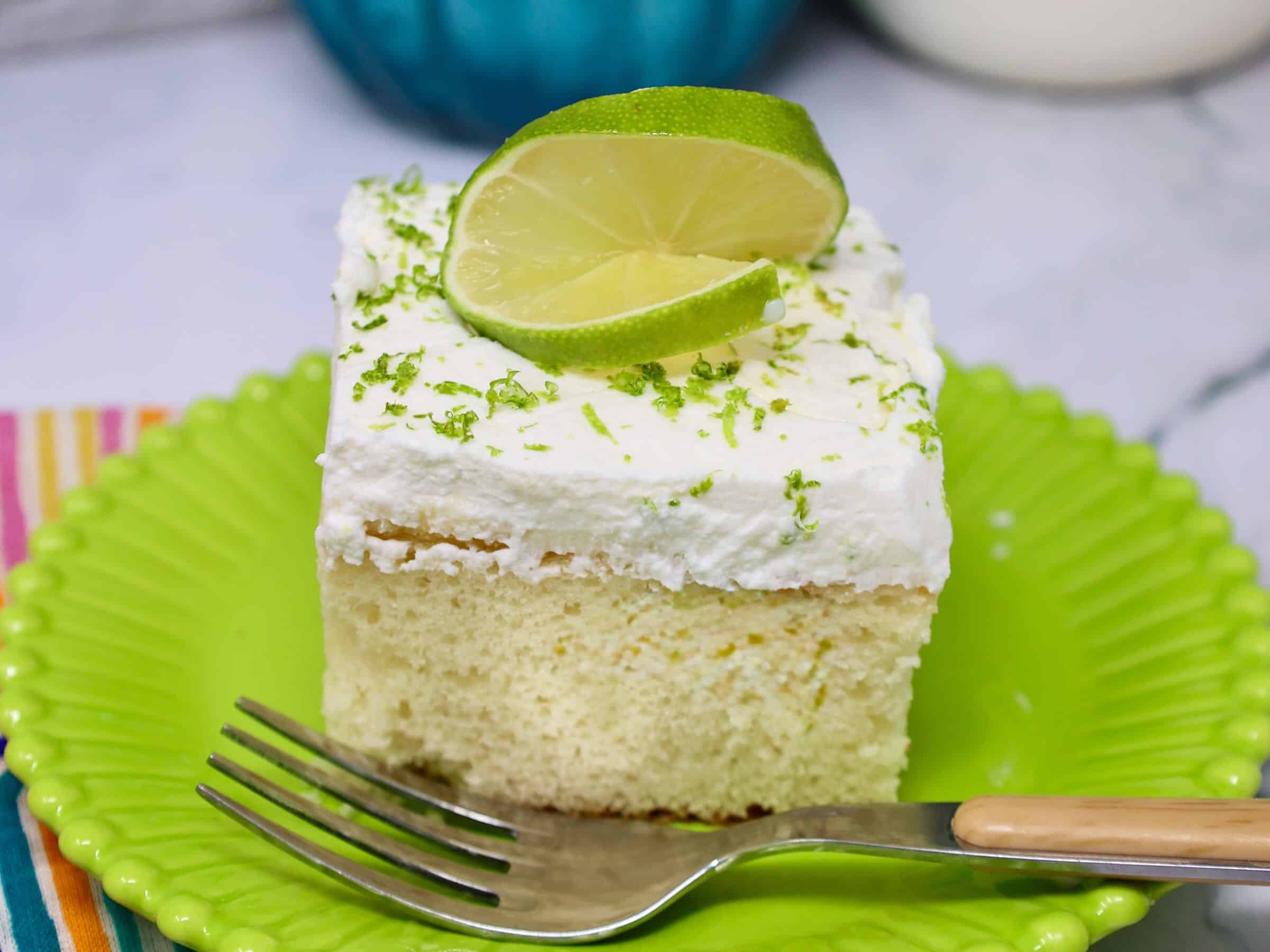 adding key lime filling to poke cake with condensed milk mixture