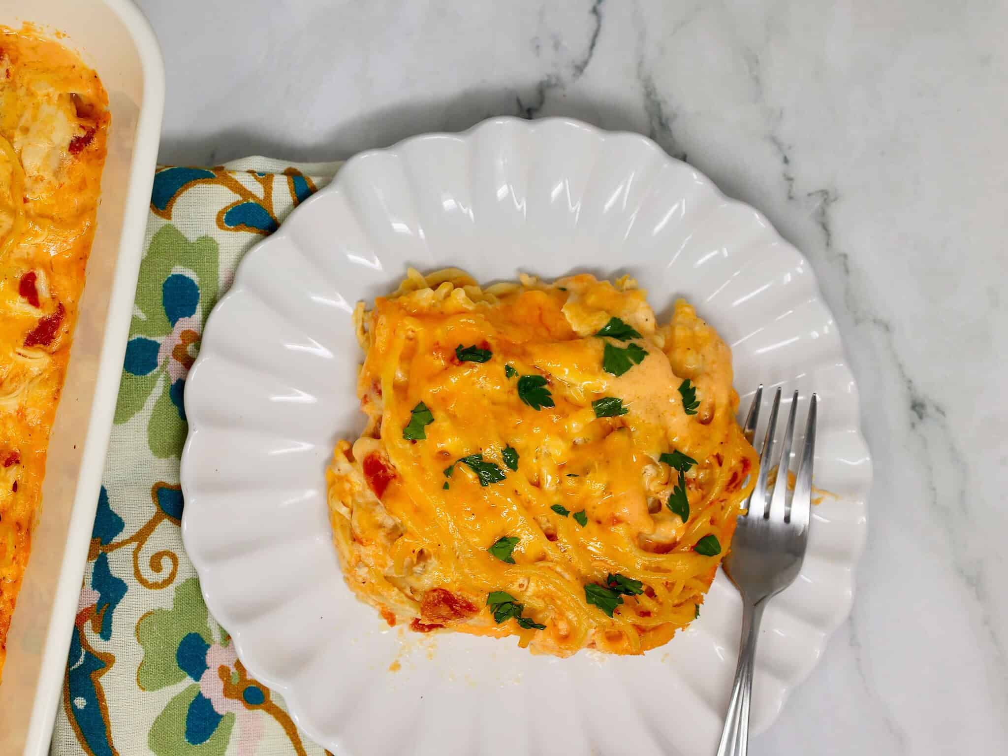 Creamy chicken spaghetti casserole with Rotel and cheddar cheese, easy family dinner