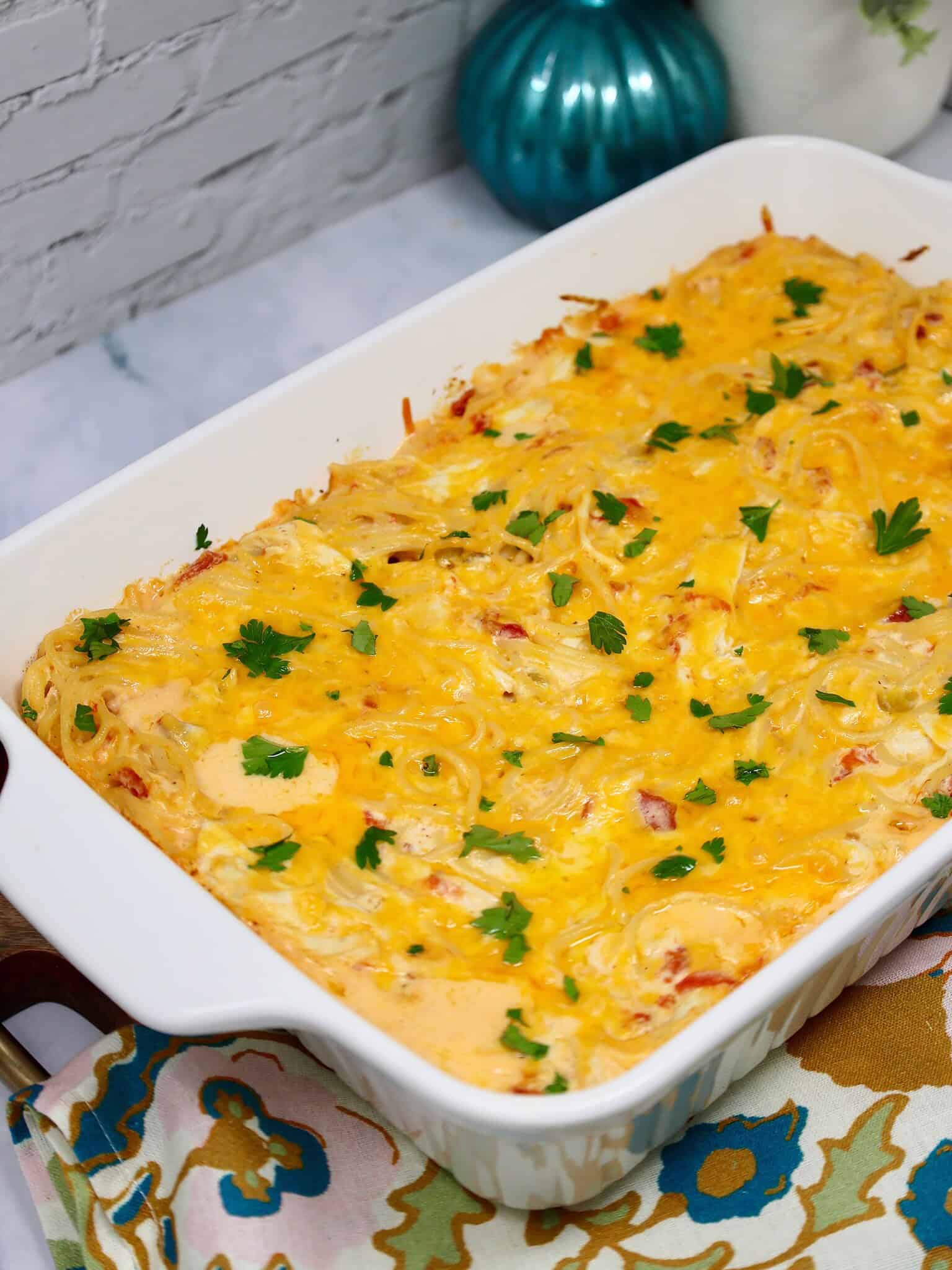 Comfort food dinner featuring creamy chicken spaghetti casserole and simple sides