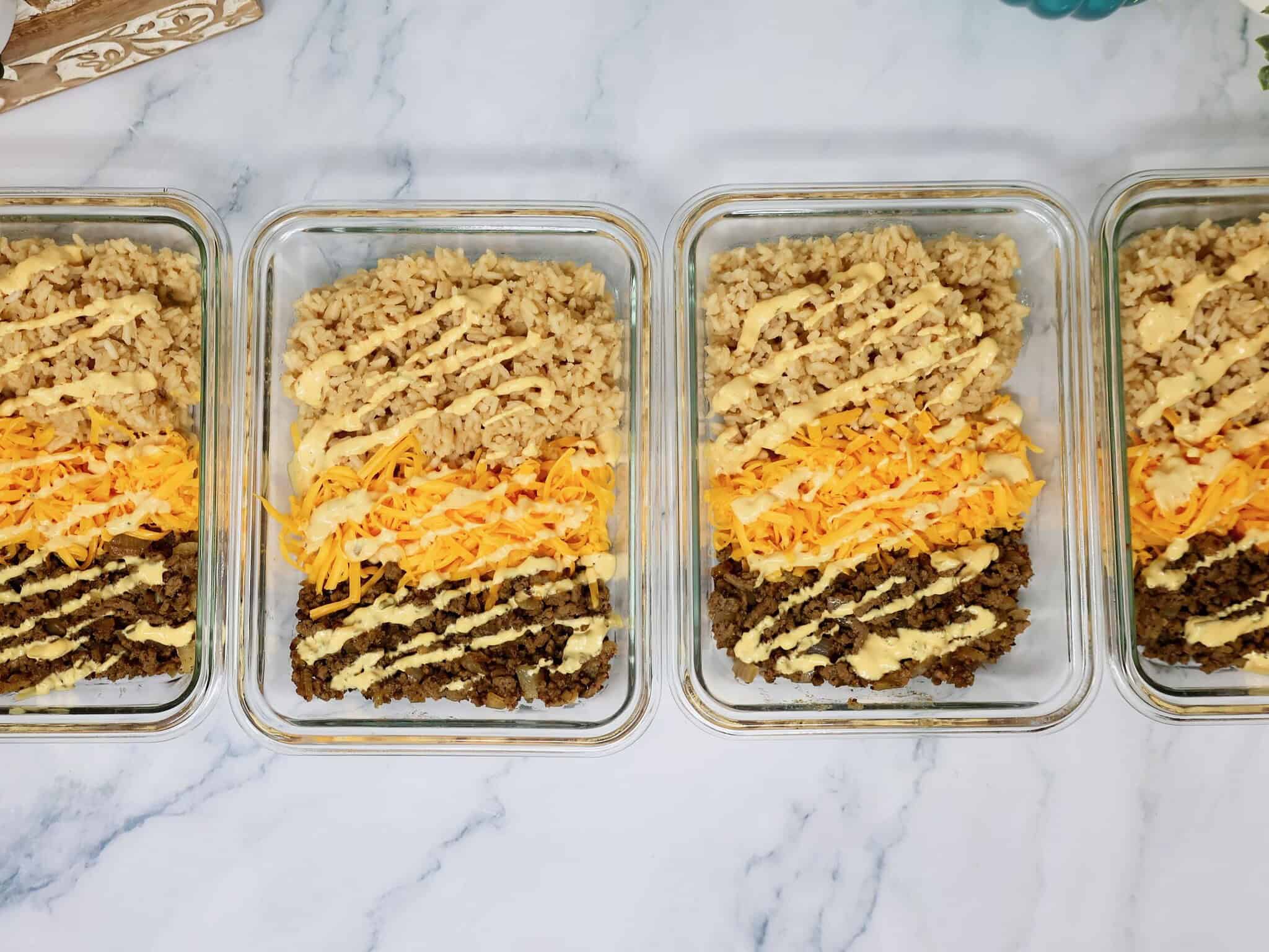 Easy Cheeseburger Rice Bowls made with ground beef, rice, shredded cheddar cheese, and creamy burger sauce
