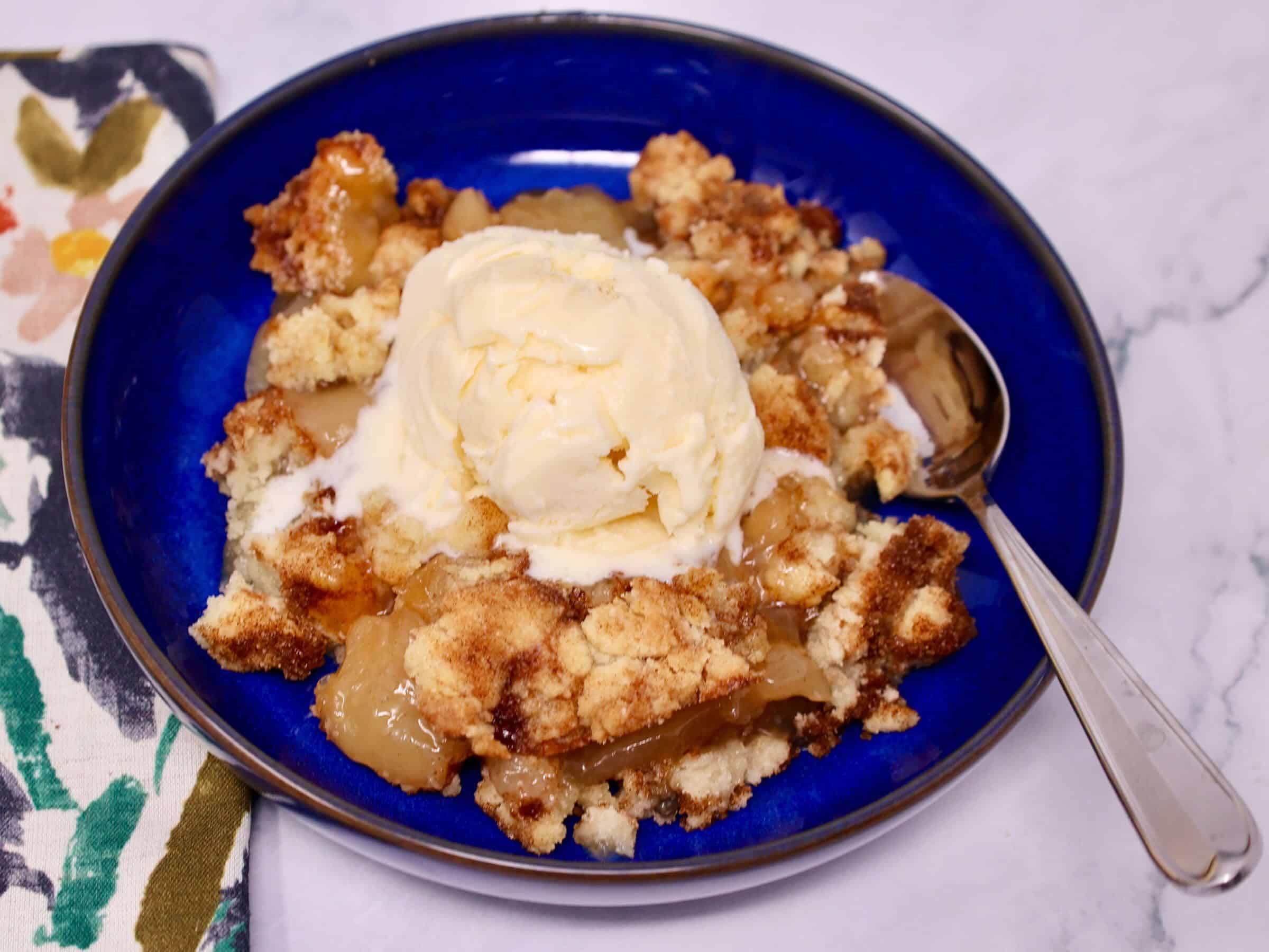 Easy apple crisp with snickerdoodle cookie topping served warm for a simple fall dessert recipe