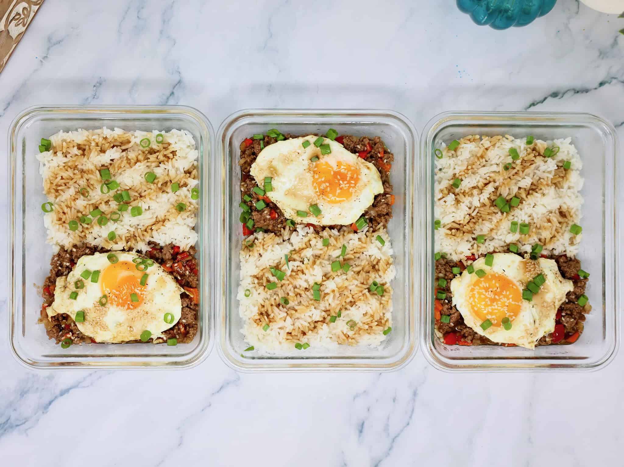 Teriyaki ground beef meal prep bowls stored in glass containers for make-ahead lunches