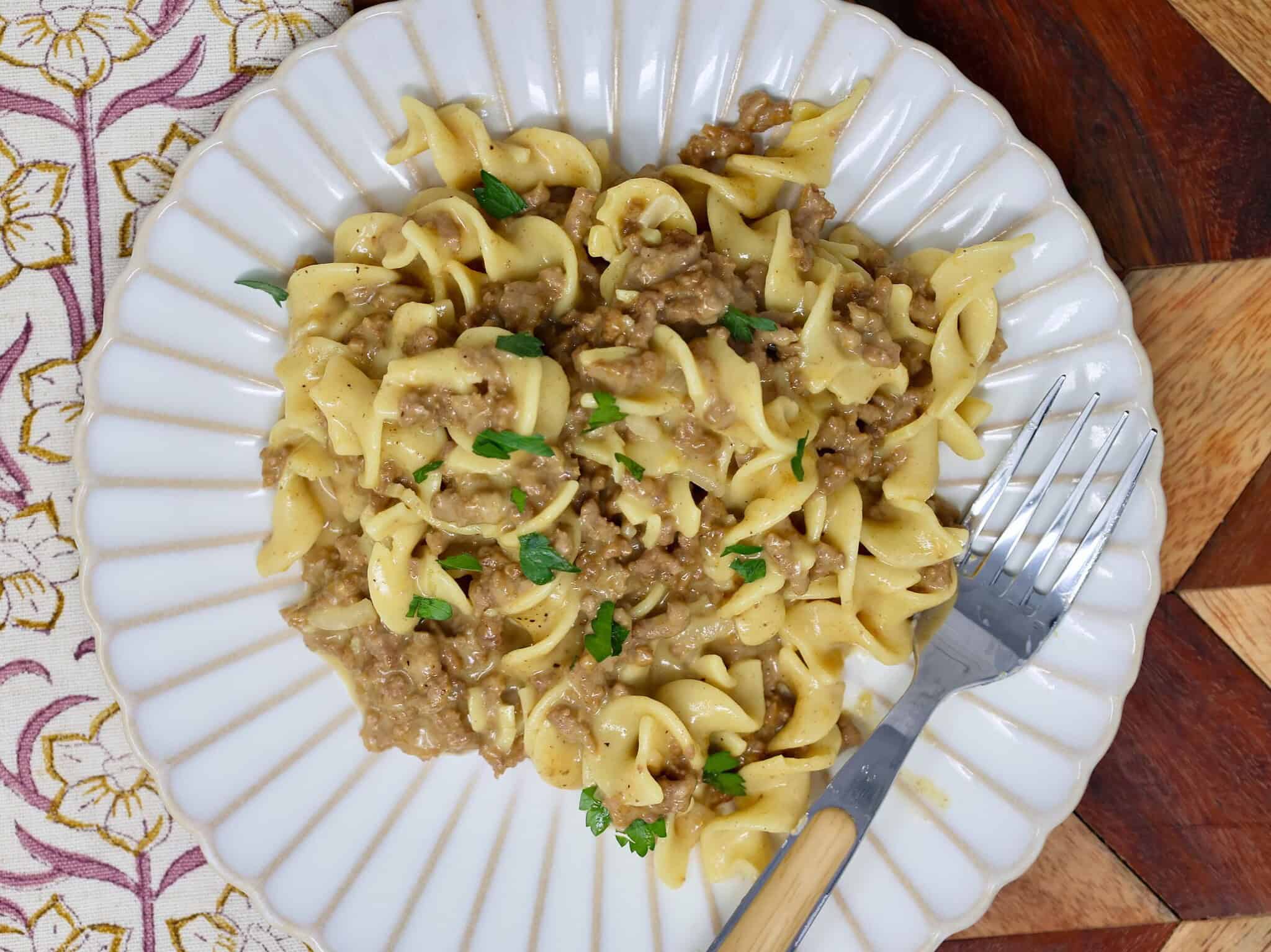Creamy beef and noodles served on a white plate