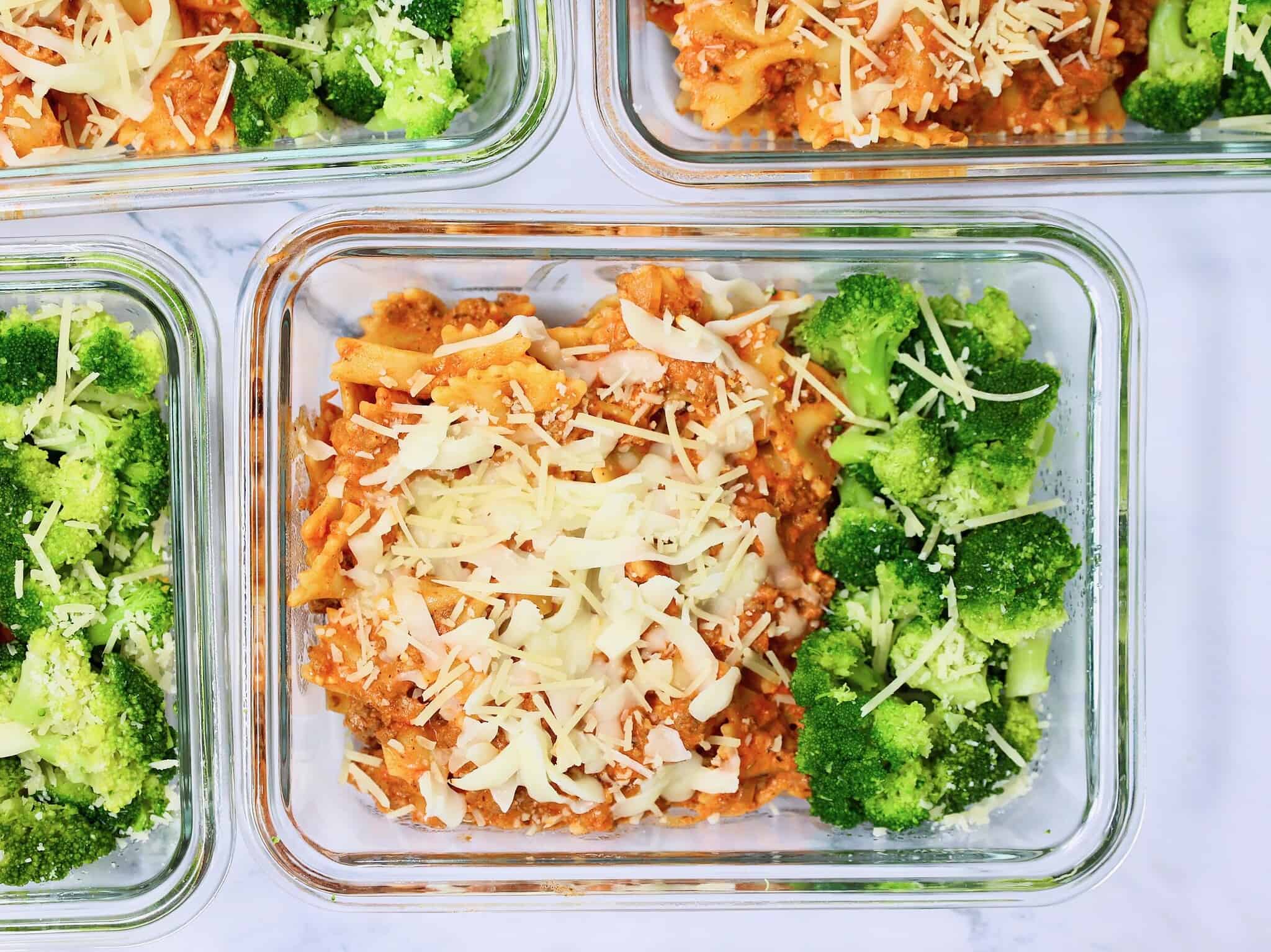 Close-up of creamy bowtie pasta with ground beef, mozzarella, and Parmesan cheese