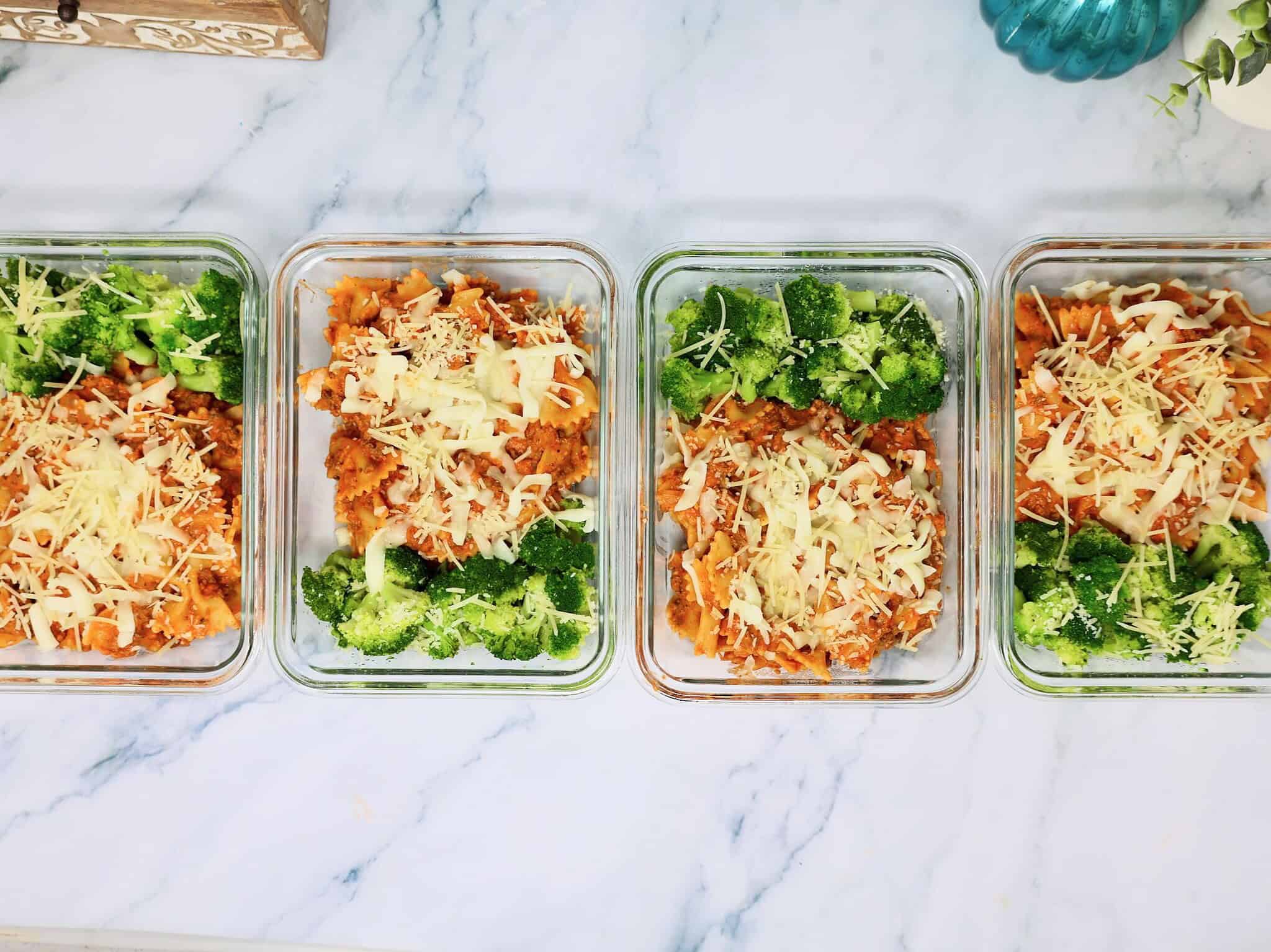 Four creamy ground beef pasta meal prep bowls ready for the refrigerator