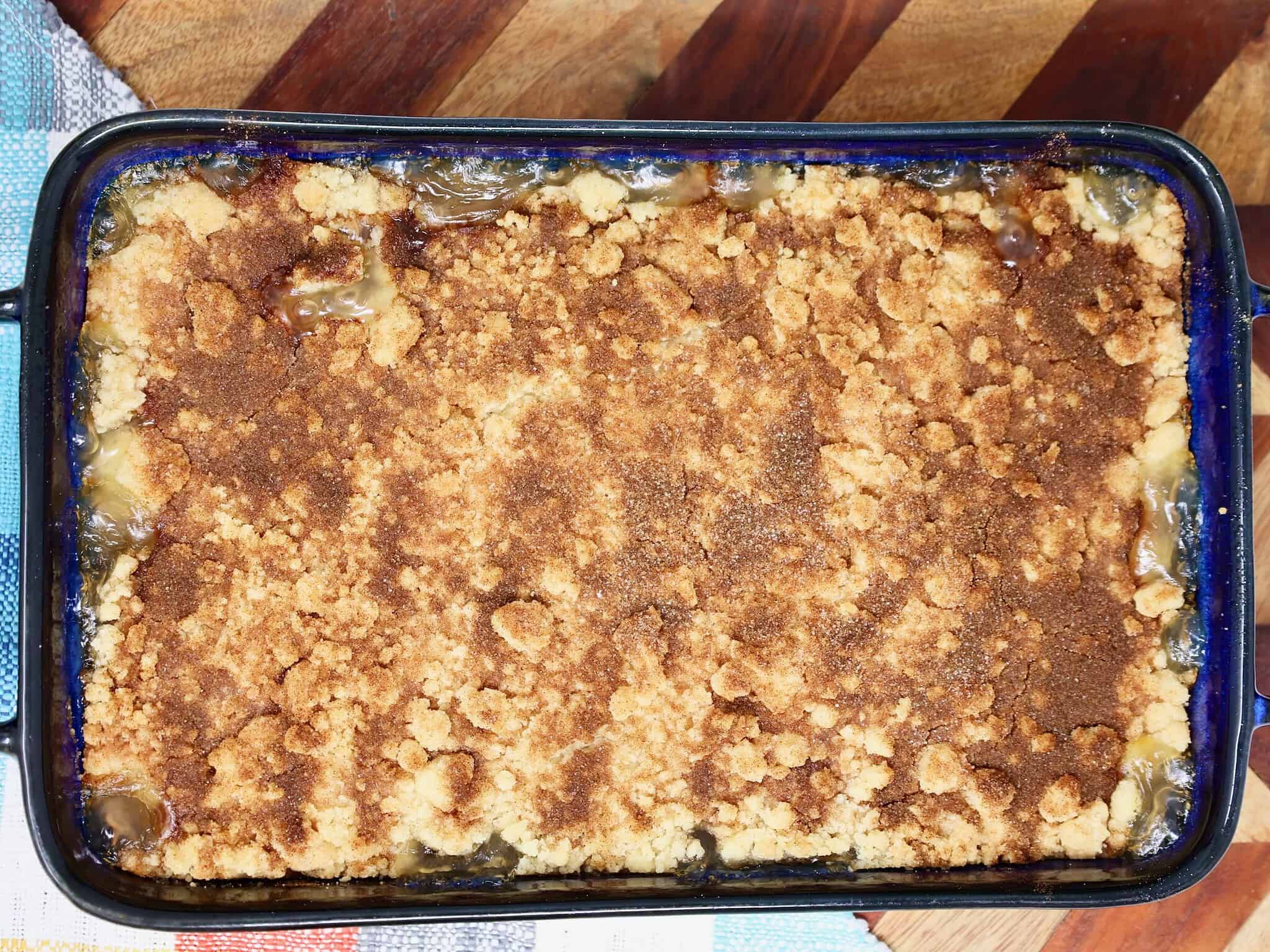 Easy 3 ingredient snickerdoodle peach crisp in a 9x13 inch baking dish