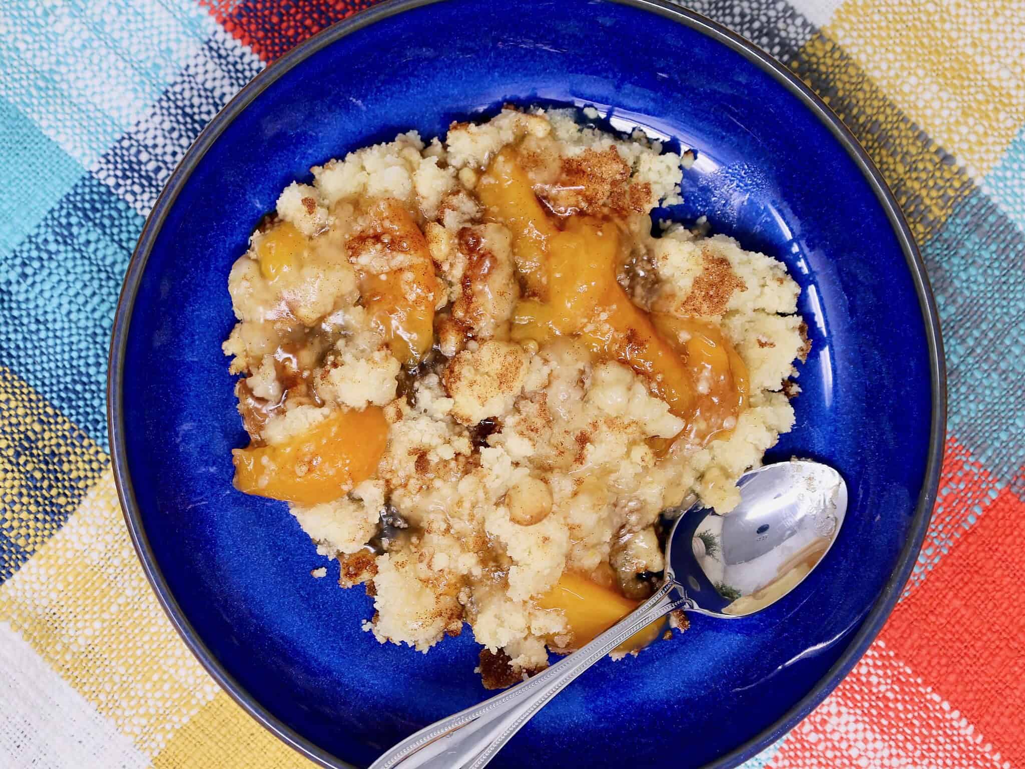 Close up of peach crisp made with peach pie filling and snickerdoodle cookie mix