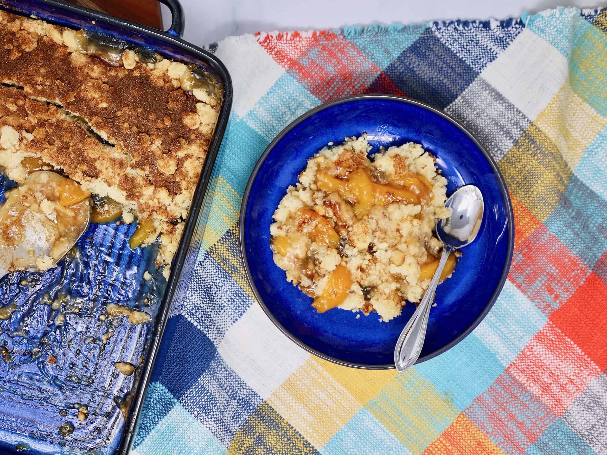 Peach crisp with buttery cookie crumble and cinnamon sugar topping