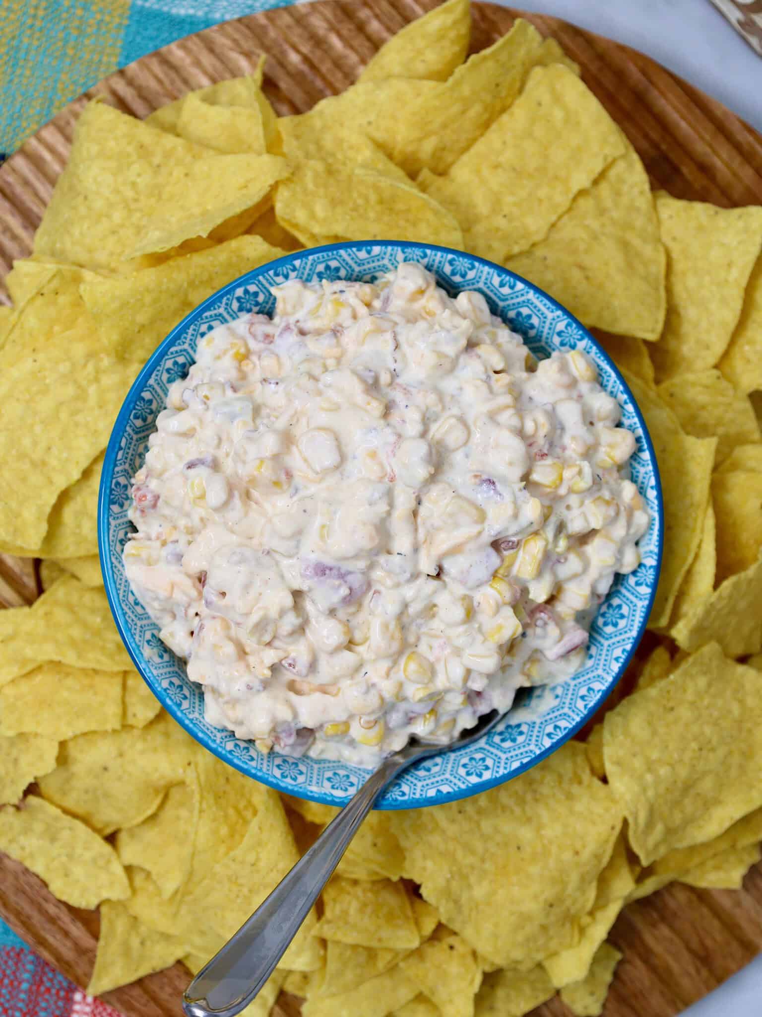 Close-up of creamy Loaded Bacon Cheddar Corn Dip with Southwest corn and Rotel